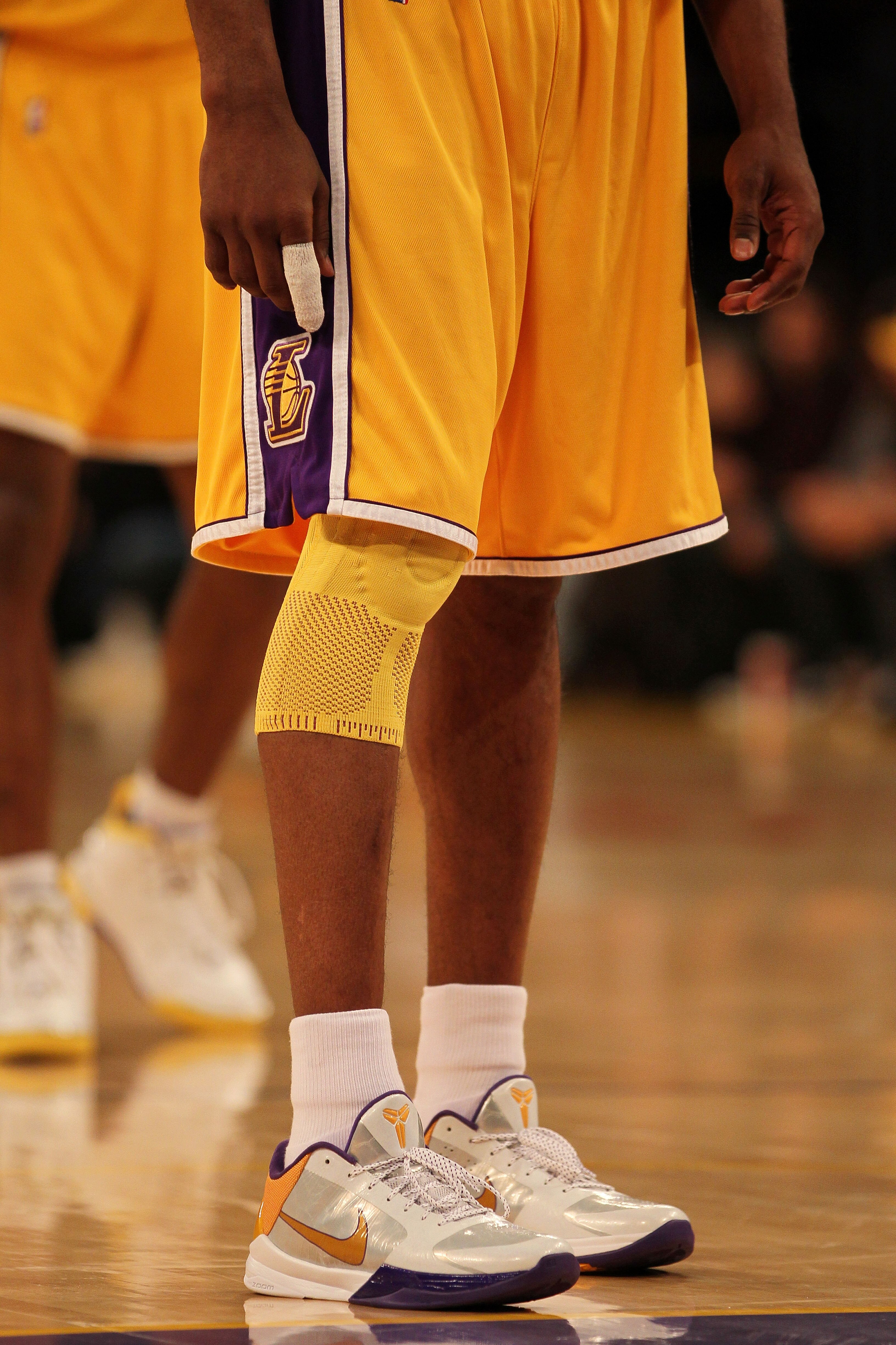 LOS ANGELES, CA - MAY 17:  Guard Kobe Bryant #24 of the Los Angeles Lakers stands with his finger wrapped and knee in a brace during the game against the Phoenix Suns in Game One of the Western Conference Finals during the 2010 NBA Playoffs at Staples Cen