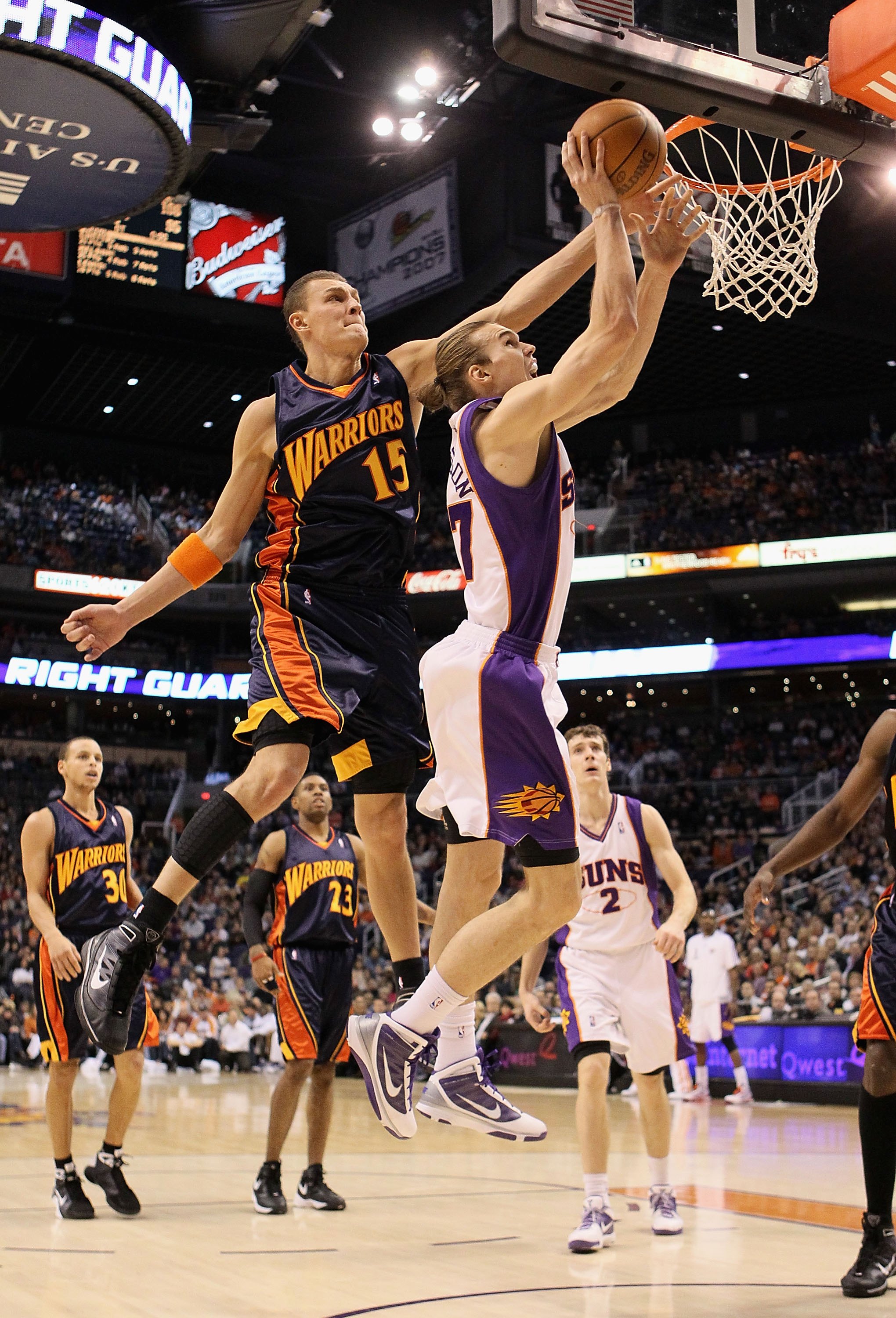 PHOENIX - JANUARY 23:  Louis Amundson #17 of the Phoenix Suns lays up a shot past Andris Biedrins #15 of the Golden State Warriors during the NBA game at US Airways Center on January 23, 2010 in Phoenix, Arizona.  The Suns defeated the Warriors 112-103.