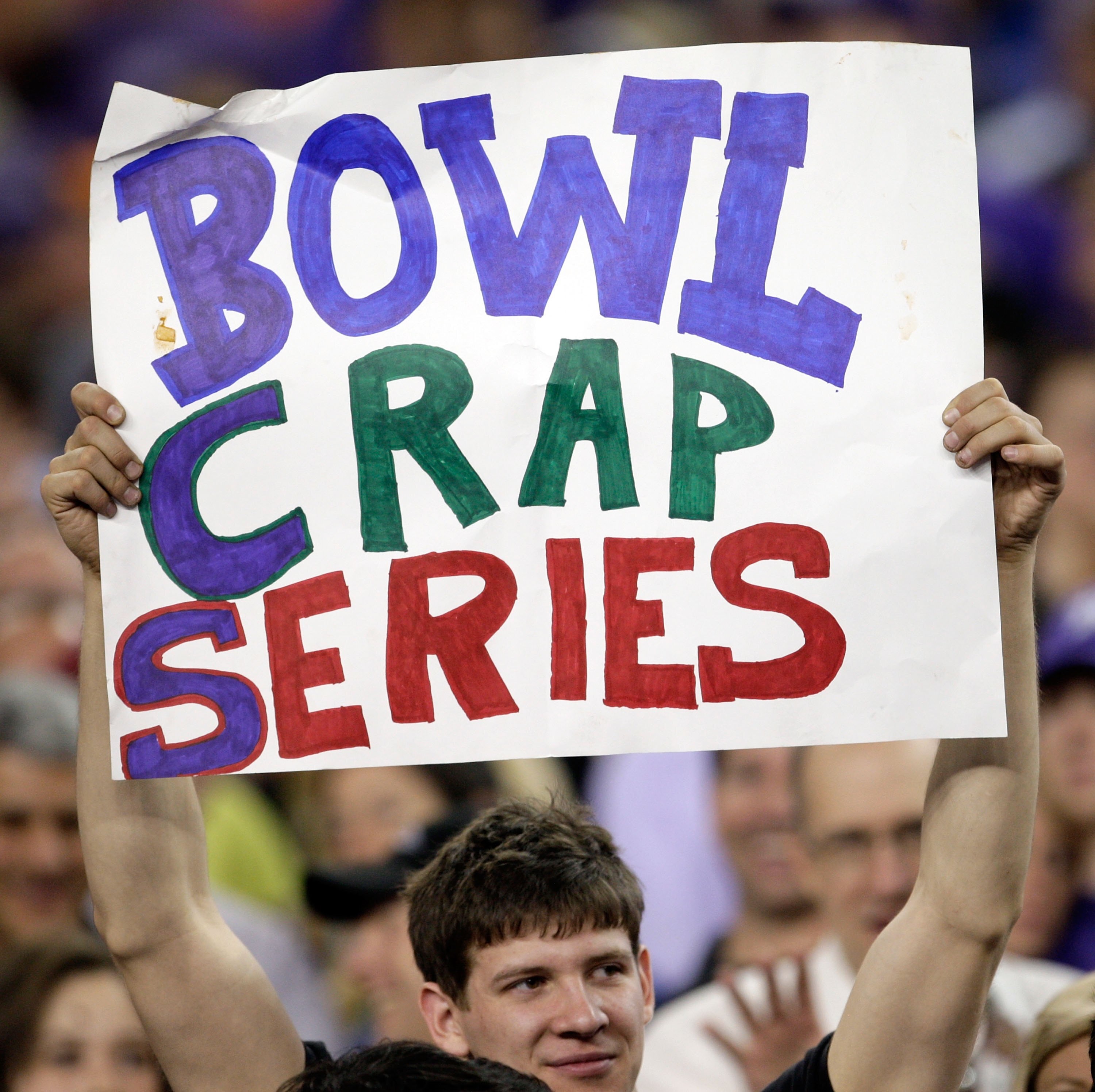 GLENDALE, AZ - JANUARY 04:  A fan holds up a sign before the Tostitos Fiesta Bowl between the Boise State Broncos and the TCU Horned Frogs at the Universtity of Phoenix Stadium on January 4, 2010 in Glendale, Arizona.  (Photo by Jamie Squire/Getty Images)