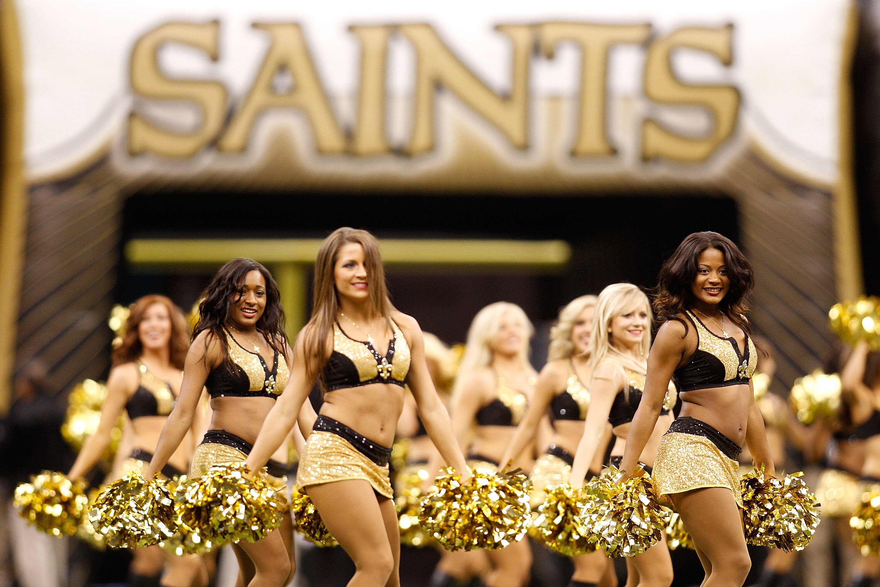 NEW ORLEANS - SEPTEMBER 26:  Mmebers of the Saintsations dance team perform before the game between the New Orleans Saints and the Atlanta Falcons at the Louisiana Superdome on September 26, 2010 in New Orleans, Louisiana.  (Photo by Chris Graythen/Getty