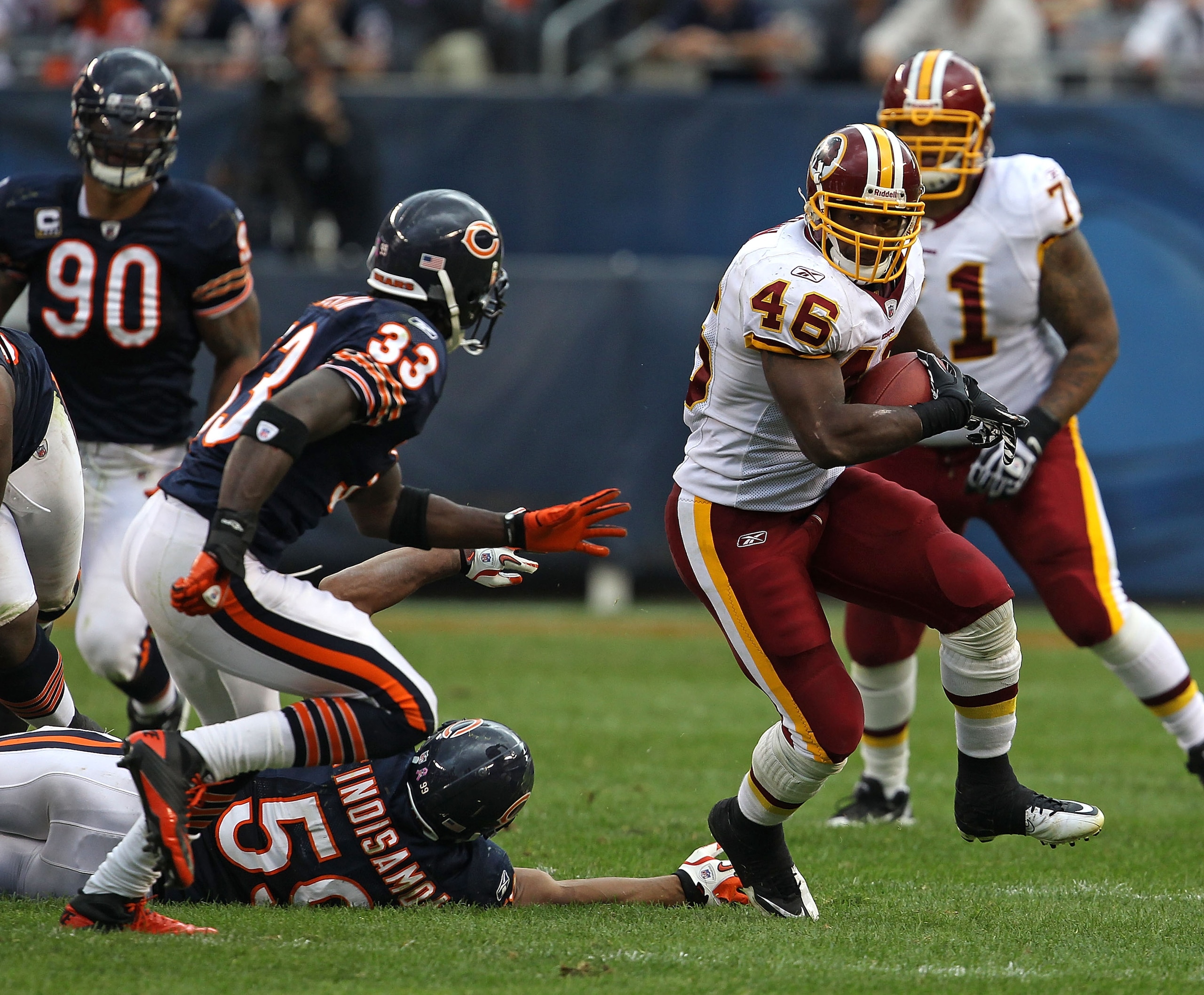CHICAGO - OCTOBER 24: Ryan Torain #46 of the Washington Redskins runs past Pisa Tinoisamoa #59 of the Chicago Bears as Charles Tillman #33 closes in at Soldier Field on October 24, 2010 in Chicago, Illinois. The Redskins defeated the Bears 17-14. (Photo b CHICAGO - OCTOBER 24: Ryan Torain #46 of the Washington Redskins runs past Pisa Tinoisamoa #59 of the Chicago Bears as Charles Tillman #33 closes in at Soldier Field on October 24, 2010 in Chicago, Illinois. The Redskins defeated the Bears 17-14. (Photo b