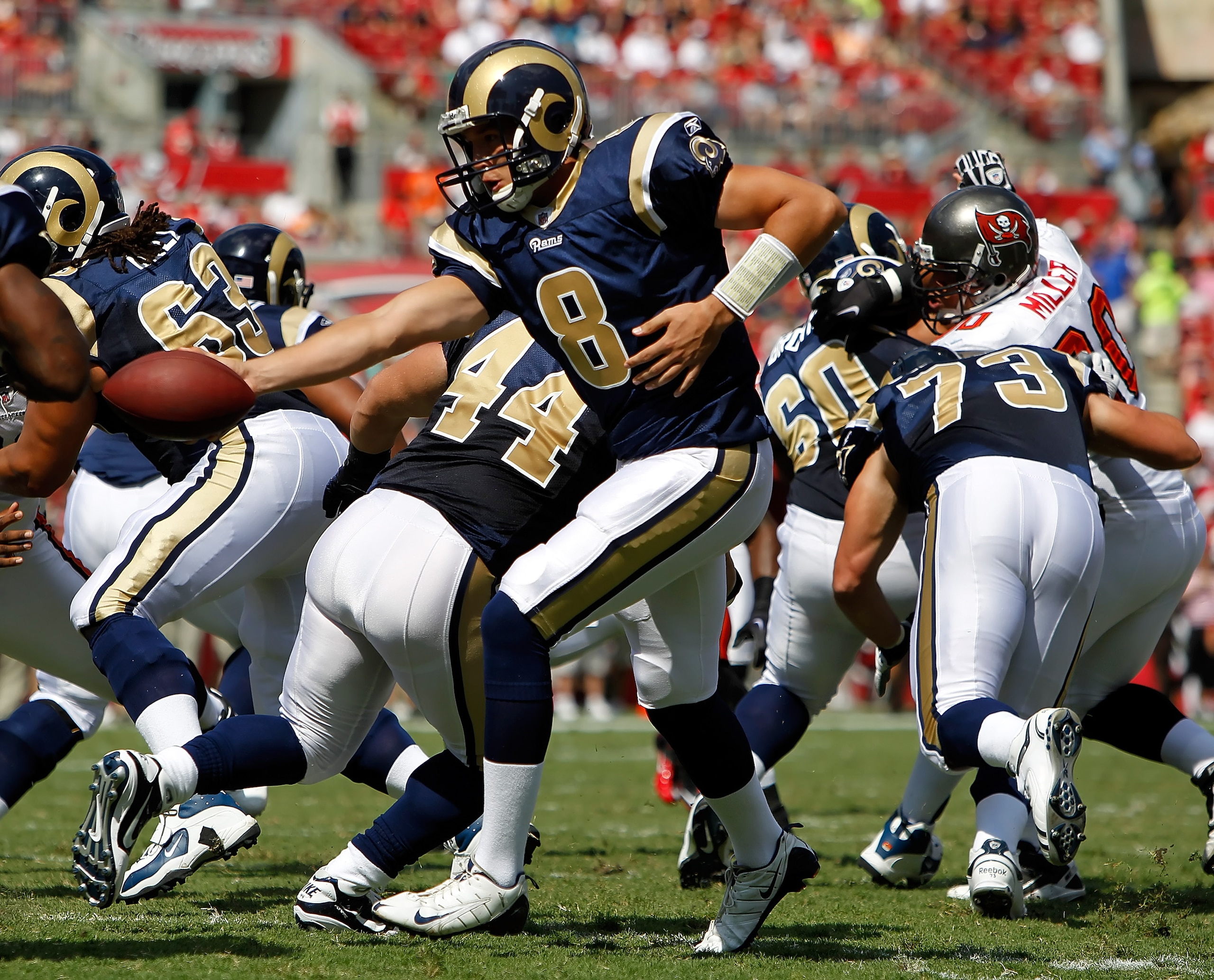 TAMPA, FL - OCTOBER 24: Quarterback Sam Bradford #8 of the St. Louis Rams hands the ball off against the Tampa Bay Buccaneers during the game at Raymond James Stadium on October 24, 2010 in Tampa, Florida. (Photo by J. Meric/Getty Images) TAMPA, FL - OCTOBER 24: Quarterback Sam Bradford #8 of the St. Louis Rams hands the ball off against the Tampa Bay Buccaneers during the game at Raymond James Stadium on October 24, 2010 in Tampa, Florida. (Photo by J. Meric/Getty Images)