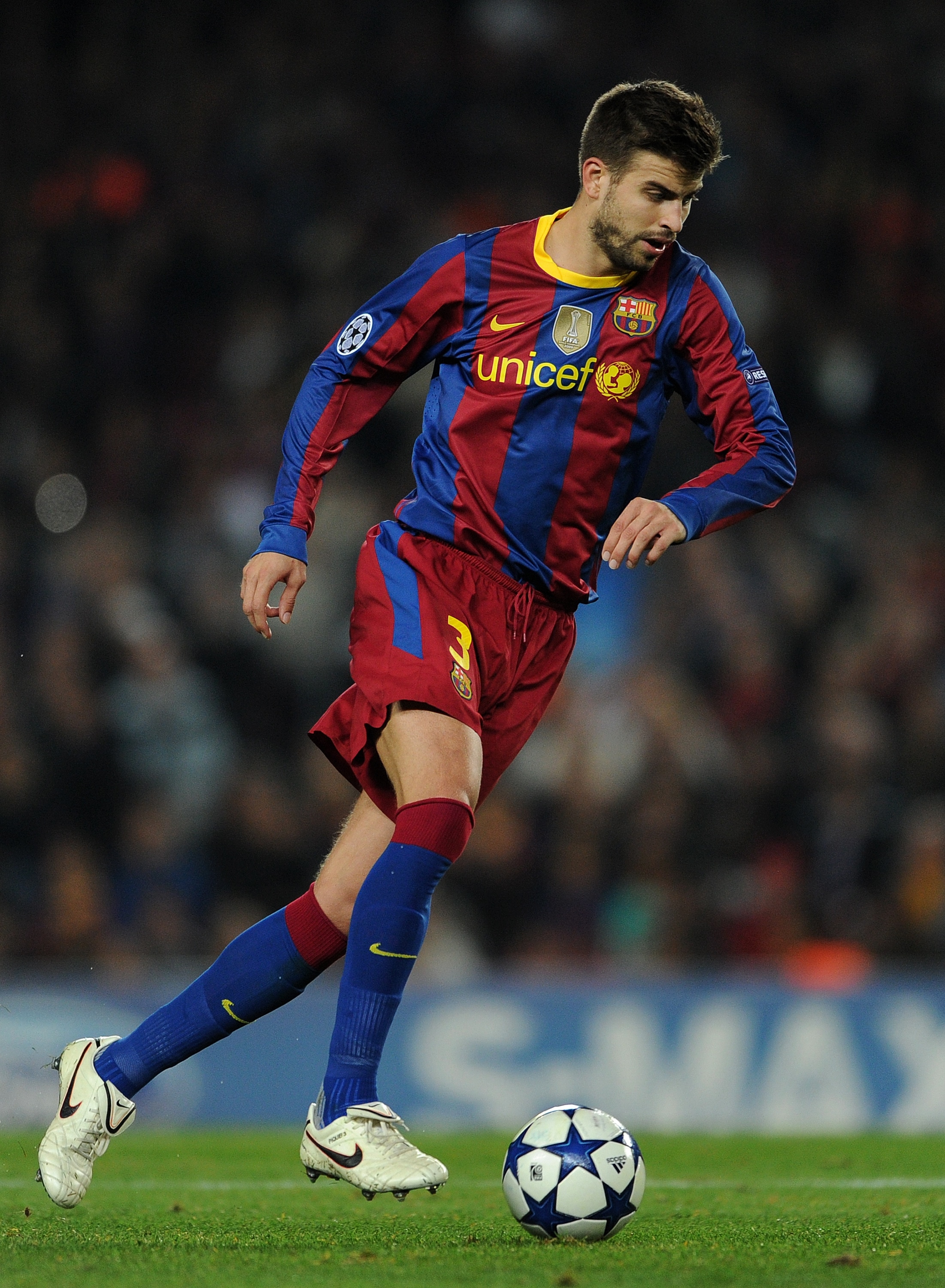 BARCELONA, SPAIN - OCTOBER 20:  Gerard Pique of Barcelona controls the ball during the UEFA Champions League group D match between Barcelona and FC Copenhagen at the Camp Nou stadium on October 20, 2010 in Barcelona, Spain. Barcelona won the match 2-0.  (
