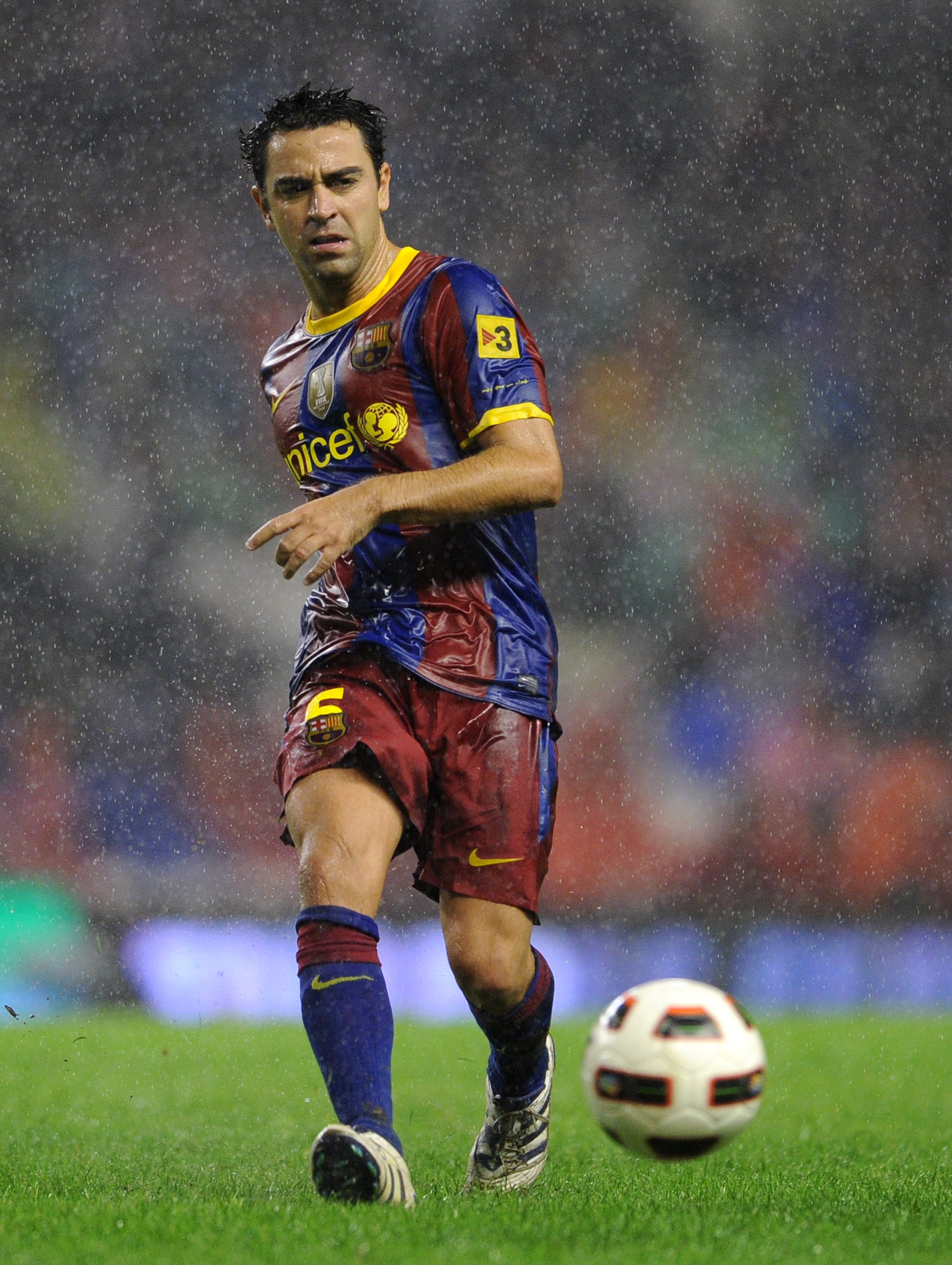 BILBAO, SPAIN - SEPTEMBER 25:  Xavi Hernandez of Barcelona passes the ball during the La Liga match between Athletic Bilbao and Barcelona at the San Mames Stadium on September 25, 2010 in Bilbao, Spain. Barcelona won the match 3-1.  (Photo by Jasper Juine