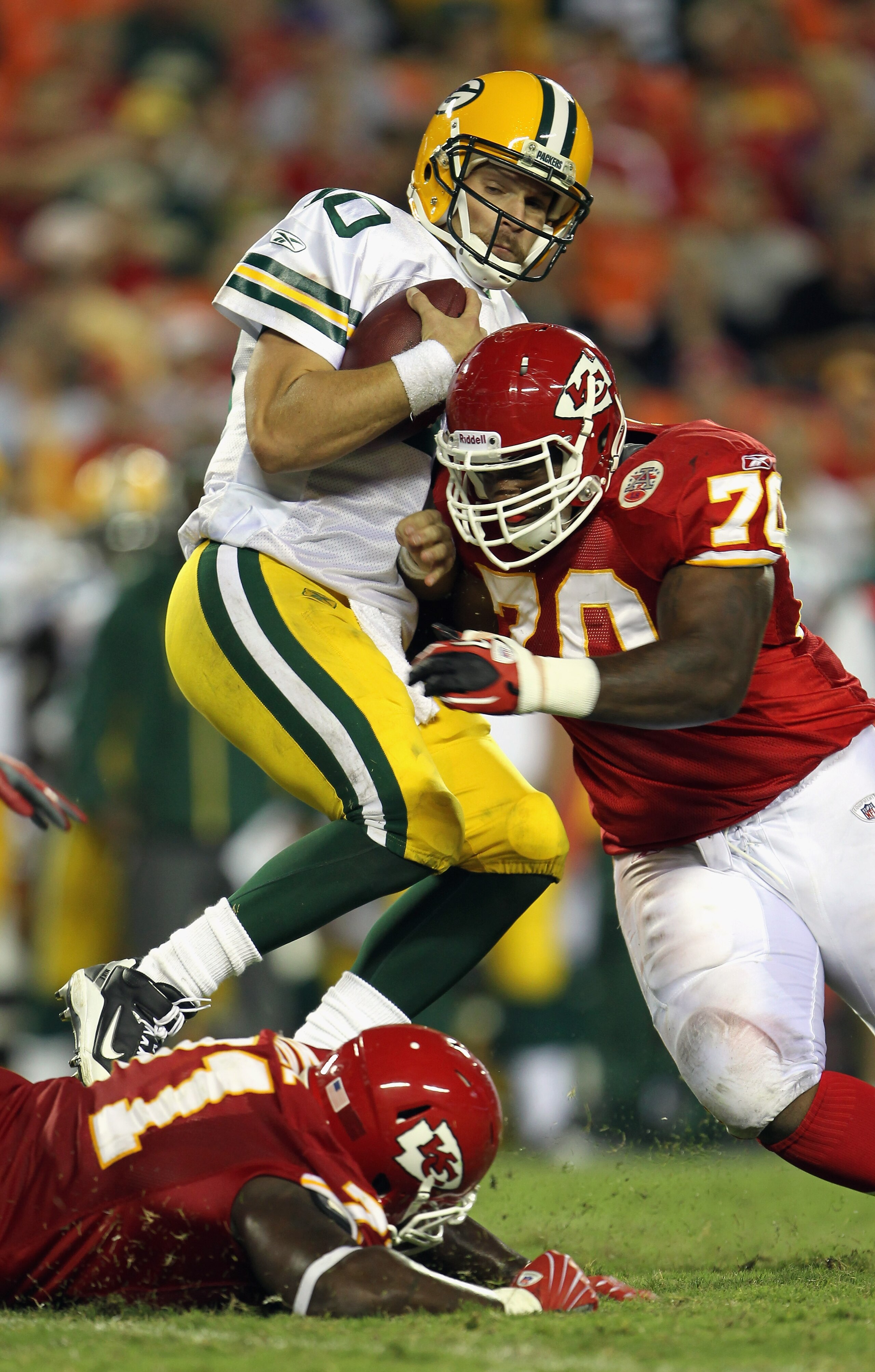 KANSAS CITY, MO - SEPTEMBER 02:  Starting quarterback Matt Flynn #10 of the Green Bay Packers is sacked by Dion Gales #70 of the Kansas City Chiefs during the game on September 2, 2010 at Arrowhead Stadium in Kansas City, Missouri.  (Photo by Jamie Squire