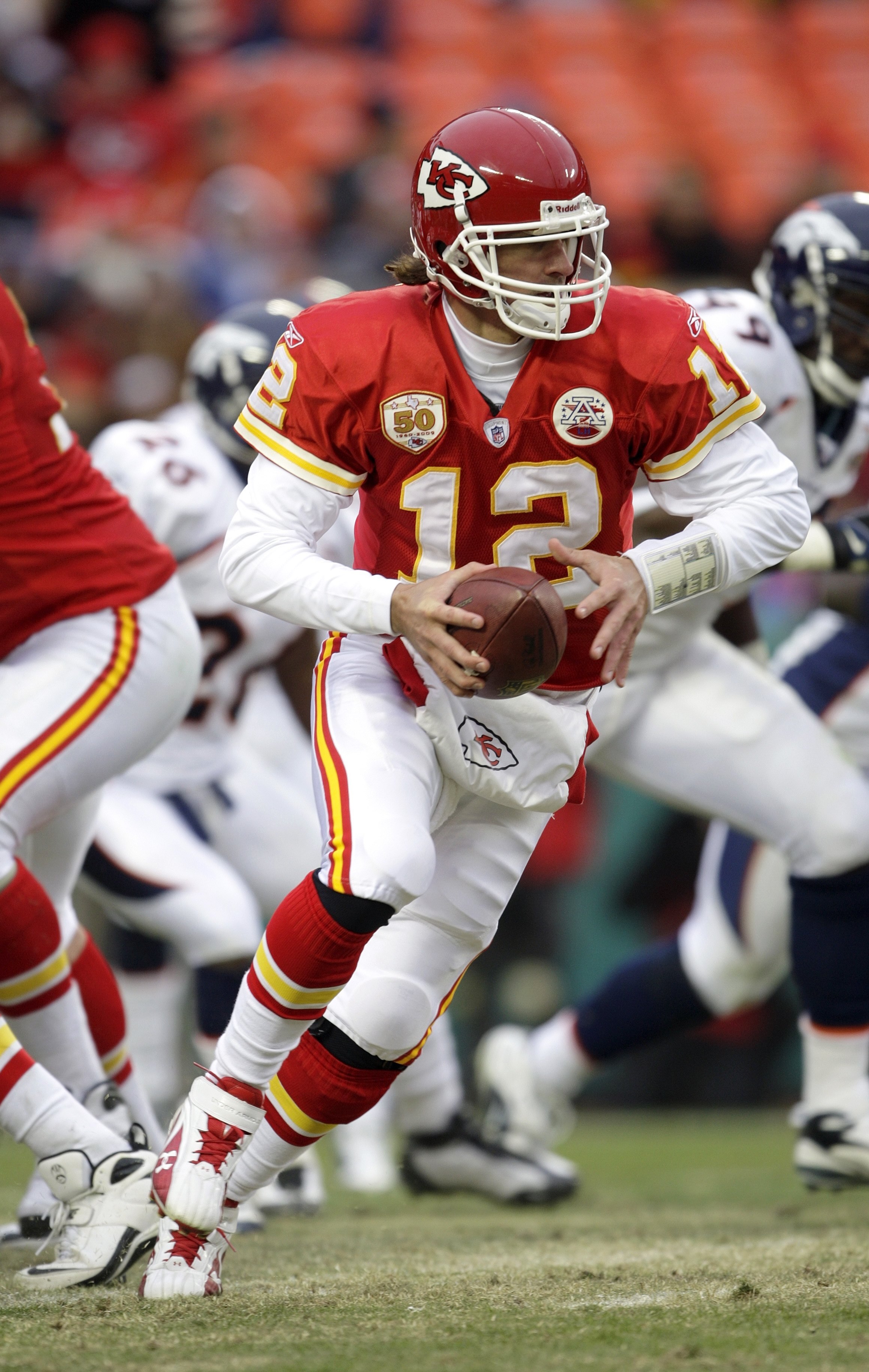 KANSAS CITY, MO - DECEMBER 6:  Quarterback Brodie Croyle #12 of the Kansas City Chiefs motions to hand off the ball during their NFL game against the Denver Broncos on December 6, 2009 at Arrowhead Stadium in Kansas City, Missouri. The Broncos defeated th