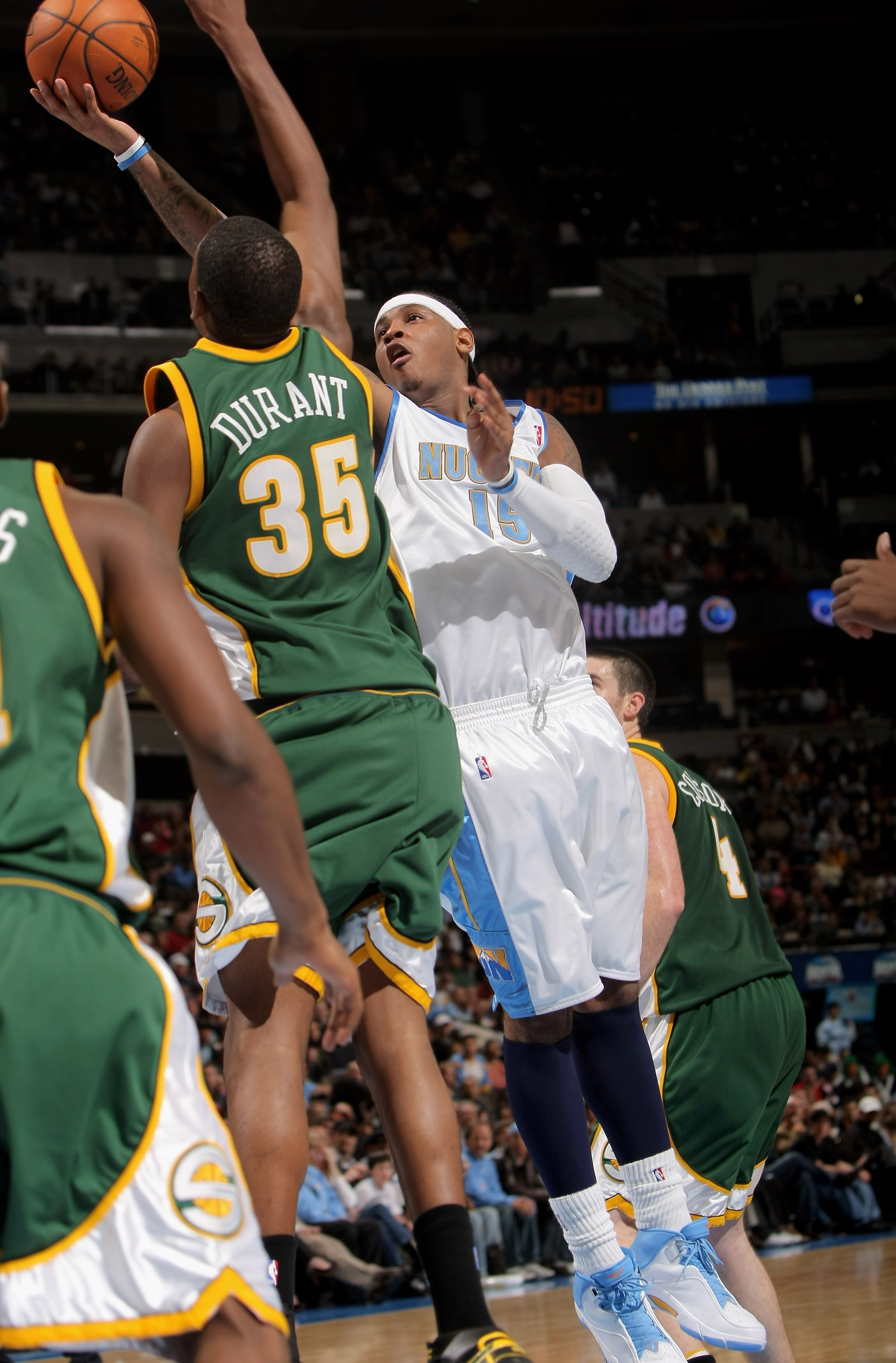 DENVER - OCTOBER 31:  Carmelo Anthony #15 of the Denver Nuggets gets off a shot over Kevin Durant #35 of the Seattle SuperSonics at the Pepsi Center on October 31, 2007 in Denver, Colorado. The Nuggets defeated the Sonics. NOTE TO USER: User expressly ack