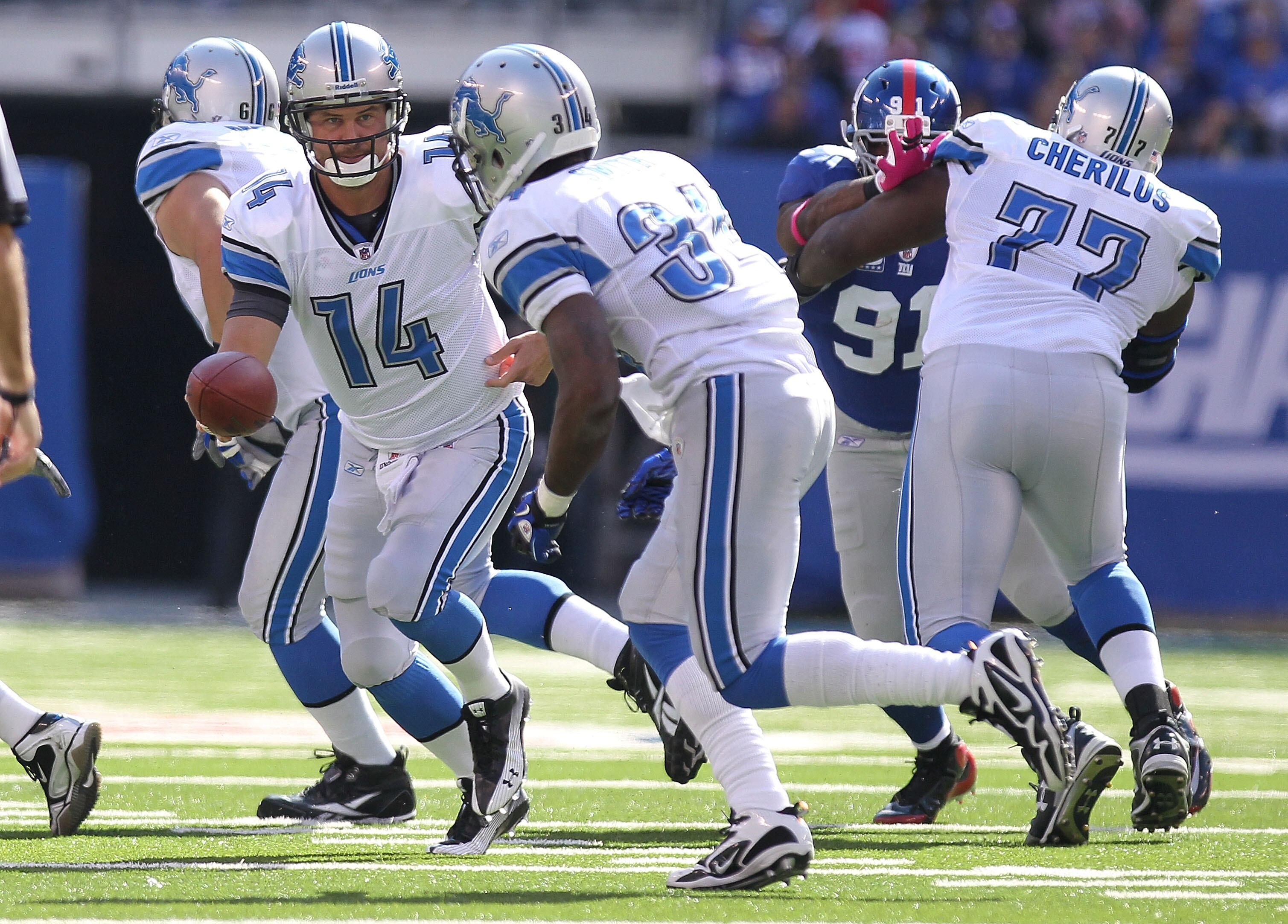 EAST RUTHERFORD, NJ - OCTOBER 17:  Shaun Hill #14 of the Detroit Lions rushes against the New York Giants at New Meadowlands Stadium on October 17, 2010 in East Rutherford, New Jersey.  (Photo by Nick Laham/Getty Images)