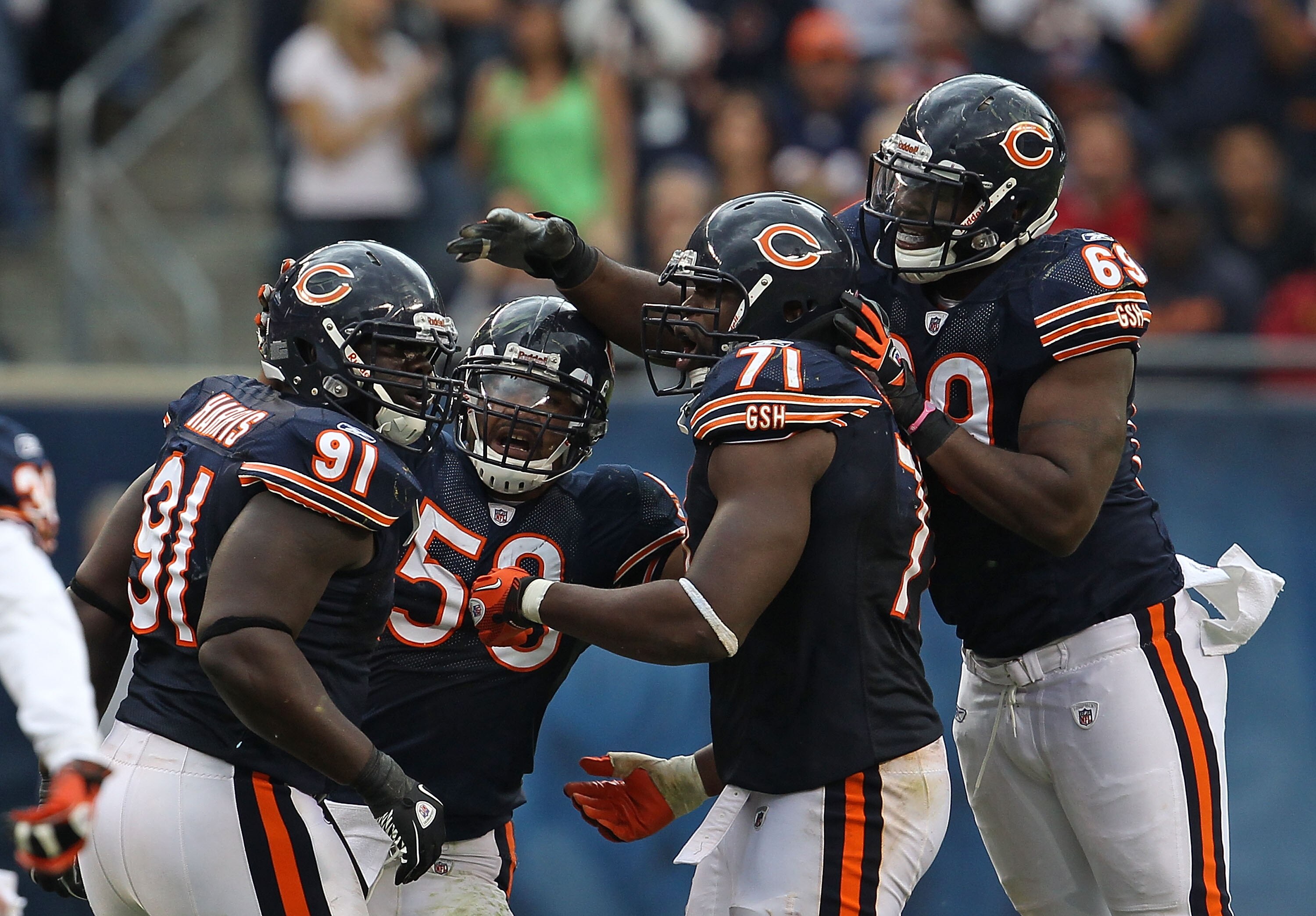 CHICAGO - OCTOBER 24: (L-R) Tommie Harris #91, Rod Wilson #58, Israel Idonije #71 and Henry Melton #69 of the Chicago Bears celebrate a defensive stop against the Washington Redskins at Soldier Field on October 24, 2010 in Chicago, Illinois. The Redskins