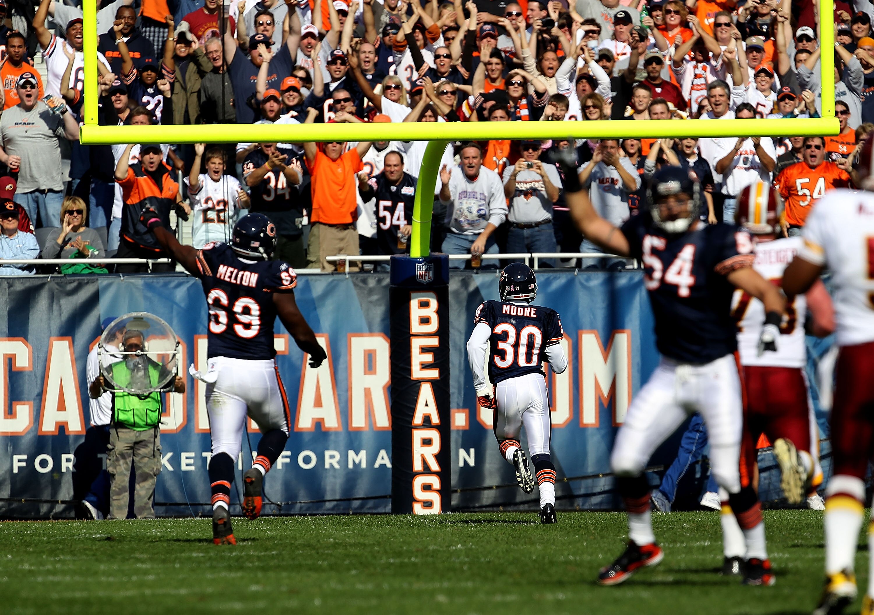 CHICAGO - OCTOBER 24: D.J. Moore #30 of the Chicago Bears runs 52 yards for a touchdown after an interception against of the Washington Redskins at Soldier Field on October 24, 2010 in Chicago, Illinois. The Redskins defeated the Bears 17-14. (Photo by Jo