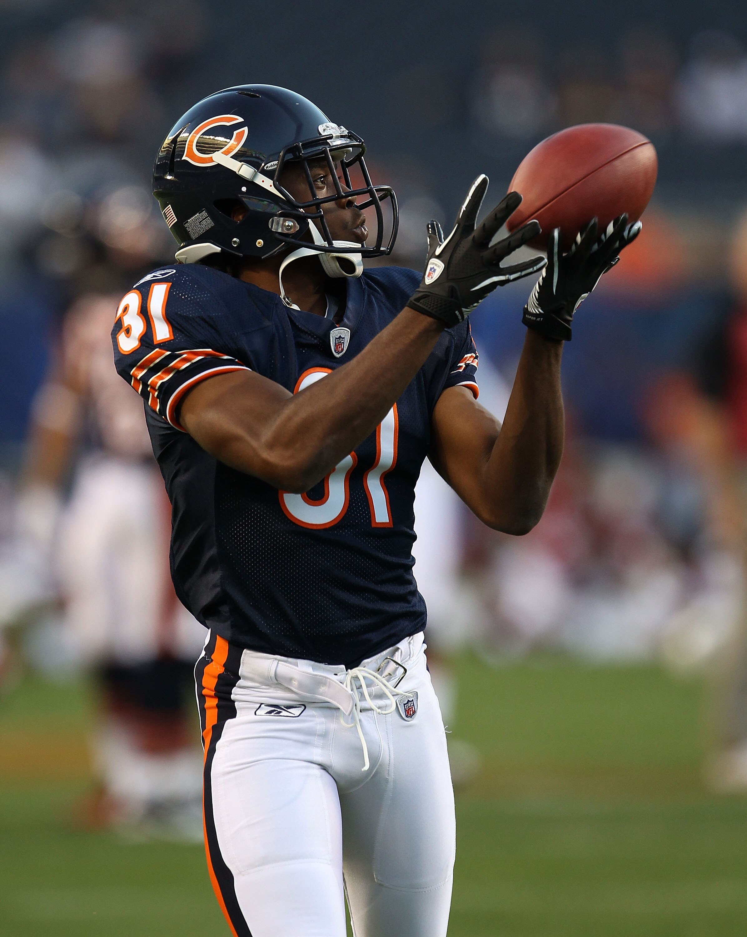 CHICAGO - AUGUST 28: Joshua Moore #31 of the Chicago Bears participates in warm-ups before a preseason game against the Arizona Cardinals at Soldier Field on August 28, 2010 in Chicago, Illinois. The Cardinals defeated the Bears 14-9. (Photo by Jonathan D