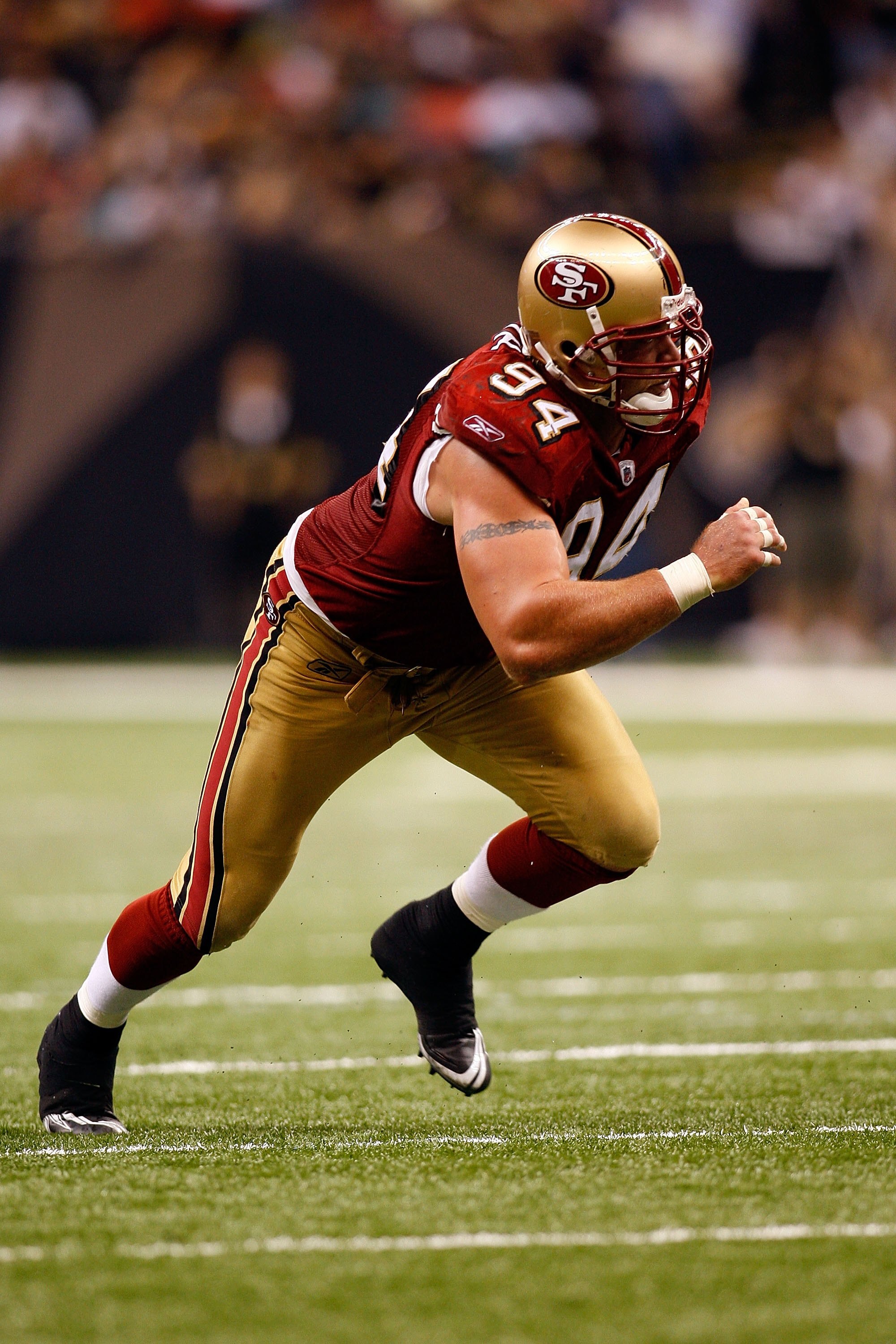 NEW ORLEANS - SEPTEMBER 28:  Justin Smith #94 of the San Francisco 49ers rushes during the game against the New Orleans Saints on September 28, 2008 at the Superdome in New Orleans, Louisiana.  (Photo by Chris Graythen/Getty Images)
