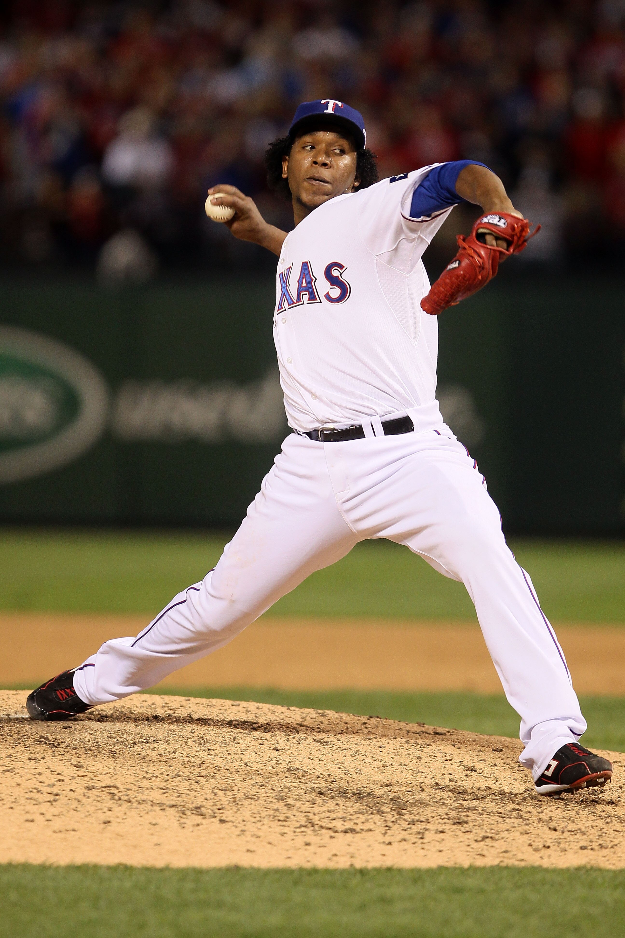 ARLINGTON, TX - OCTOBER 30:  Neftali Feliz #30 of the Texas Rangers pitches against the San Francisco Giants in Game Three of the 2010 MLB World Series at Rangers Ballpark in Arlington on October 30, 2010 in Arlington, Texas.  (Photo by Elsa/Getty Images)