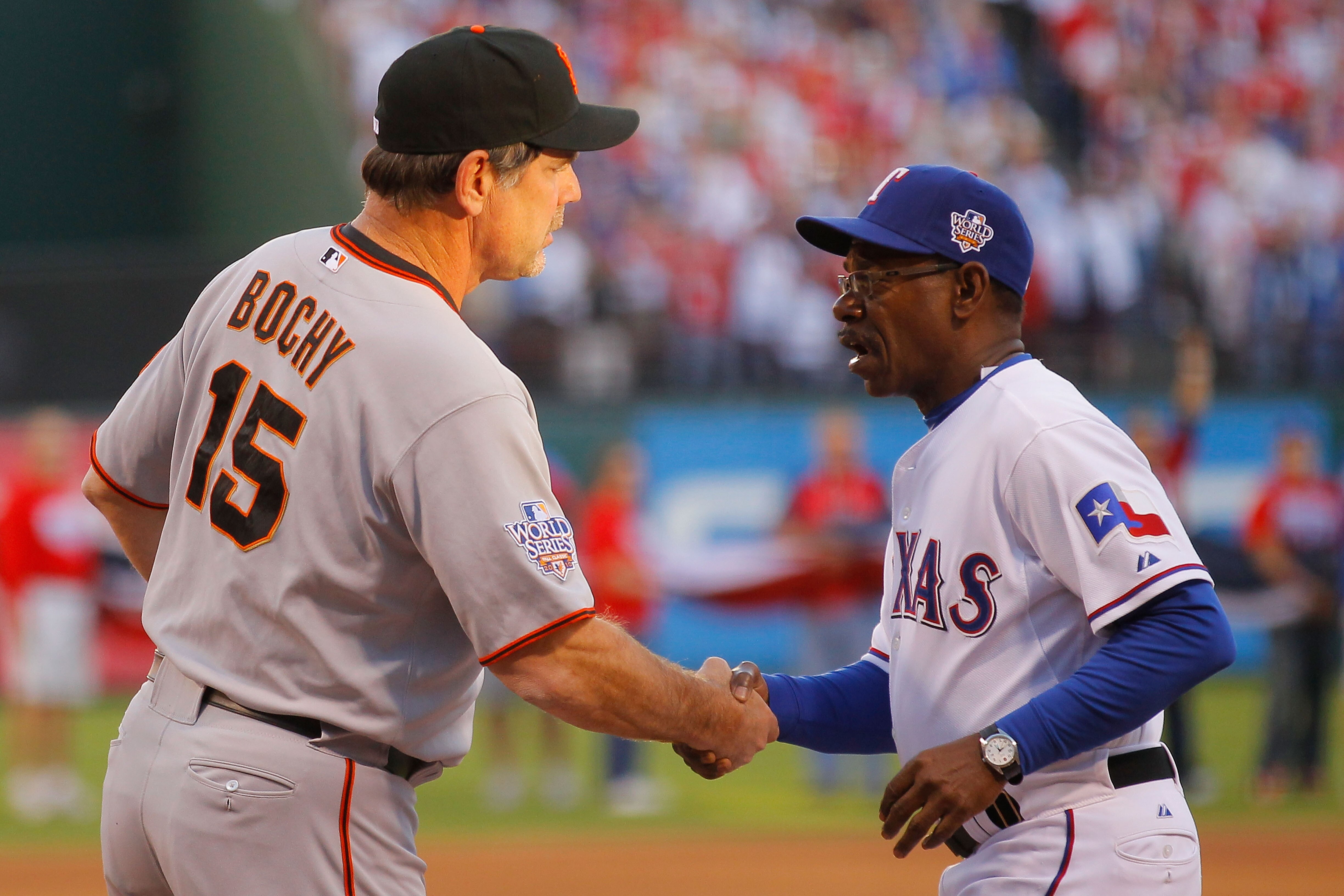 ARLINGTON, TX - OCTOBER 30:   Manager Ron Washington (R) of the Texas Rangers greets against manager Bruce Bochy the San Francisco Giants in Game Three of the 2010 MLB World Series at Rangers Ballpark in Arlington on October 30, 2010 in Arlington, Texas.