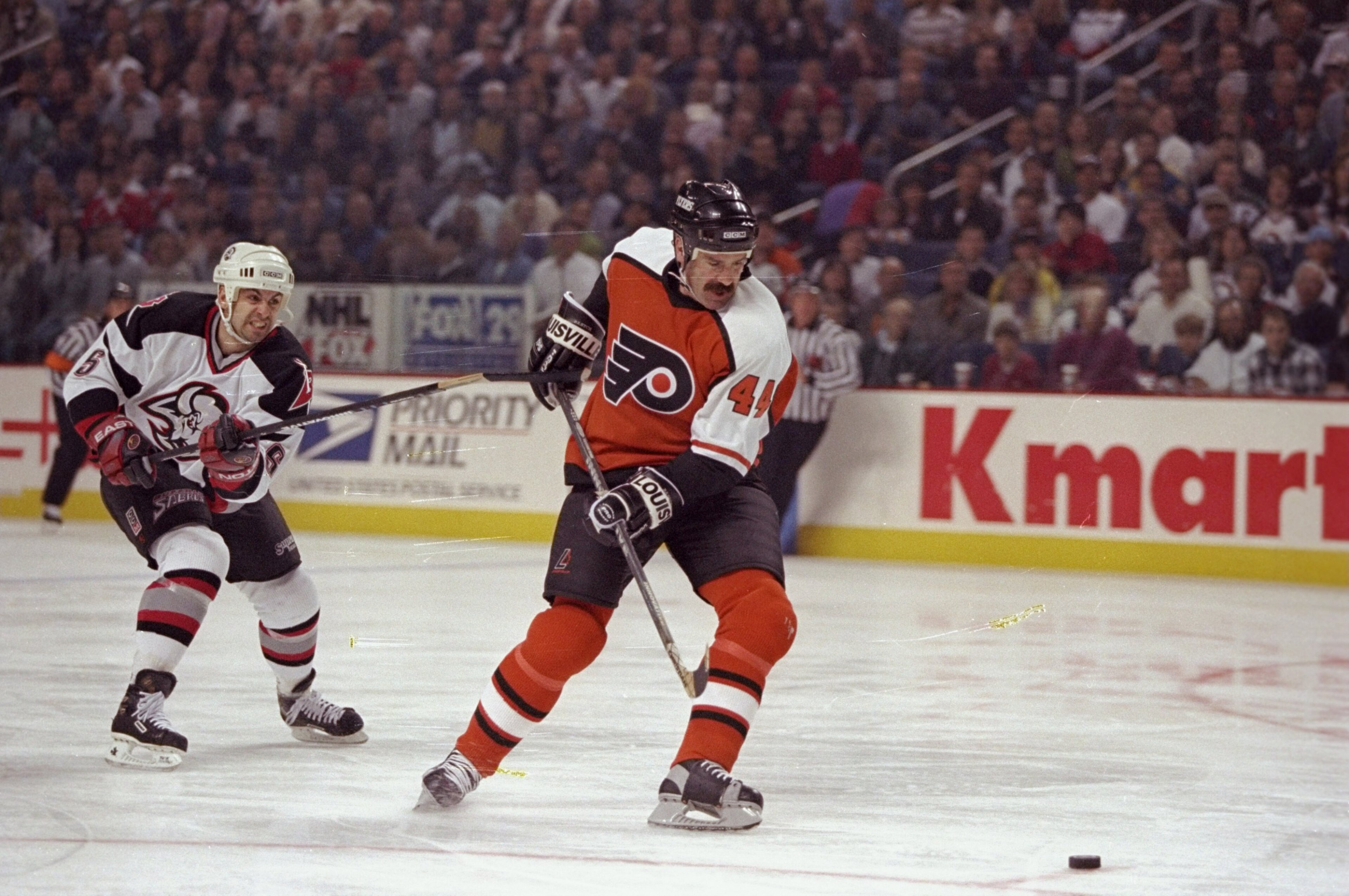 27 Apr 1998: Defenseman Dave Babych of the Philadelphia Flyers in action against defenseman Jason Woolley of the Buffalo Sabres during their NHL Playoffs game at the Marine Midland Arena in Buffalo, New York. The Sabres defeated the Flyers 6-1. Mandator 27 Apr 1998: Defenseman Dave Babych of the Philadelphia Flyers in action against defenseman Jason Woolley of the Buffalo Sabres during their NHL Playoffs game at the Marine Midland Arena in Buffalo, New York. The Sabres defeated the Flyers 6-1. Mandator
