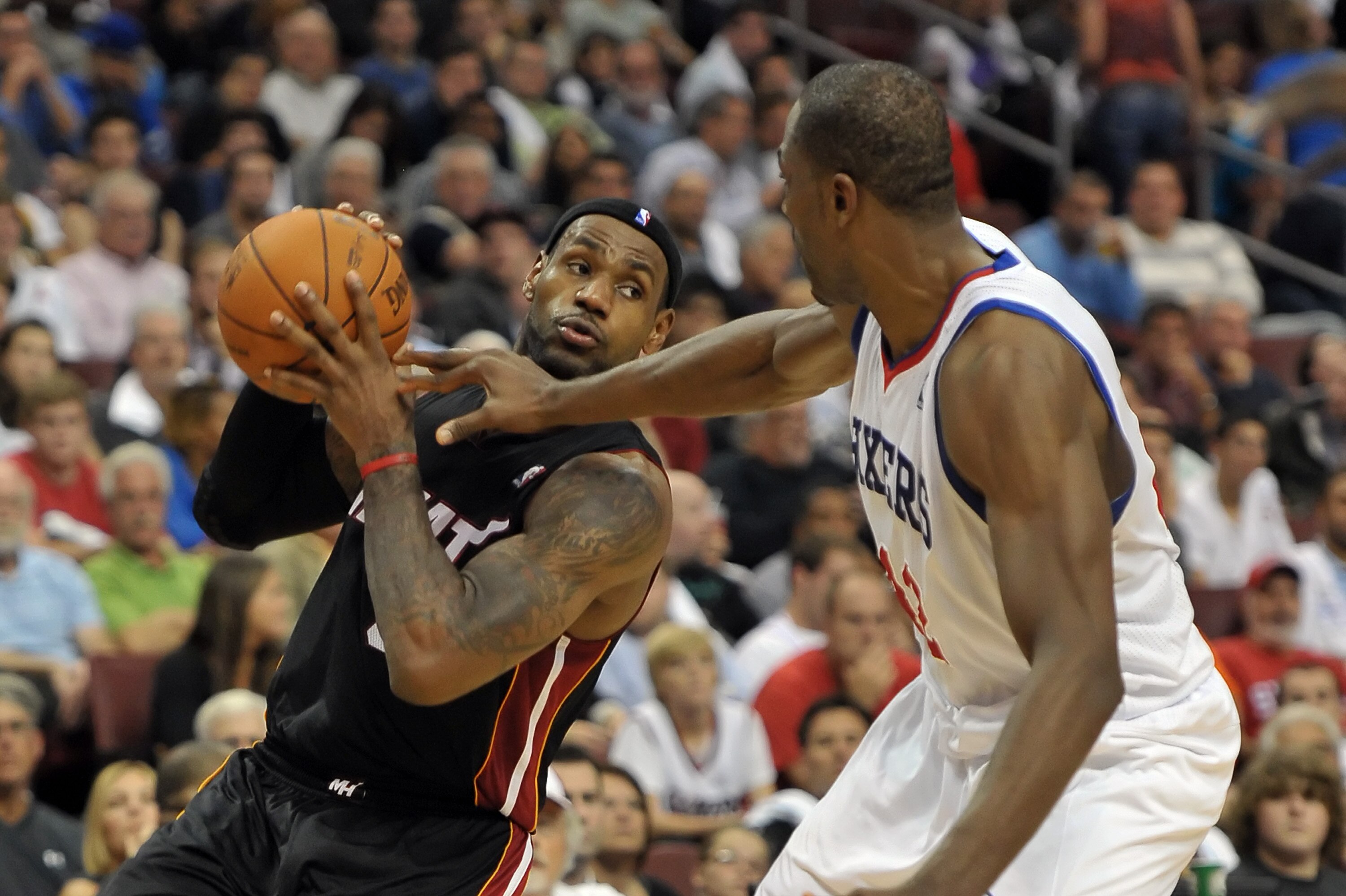 PHILADELPHIA - OCTOBER 27:  LeBron James #6 of the Miami Heat tries to drive around Elton Brand #42 of the Philadelphia 76ers at the Wells Fargo Center on October 27, 2010 in Philadelphia, Pennsylvania. NOTE TO USER: User expressly acknowledges and agrees