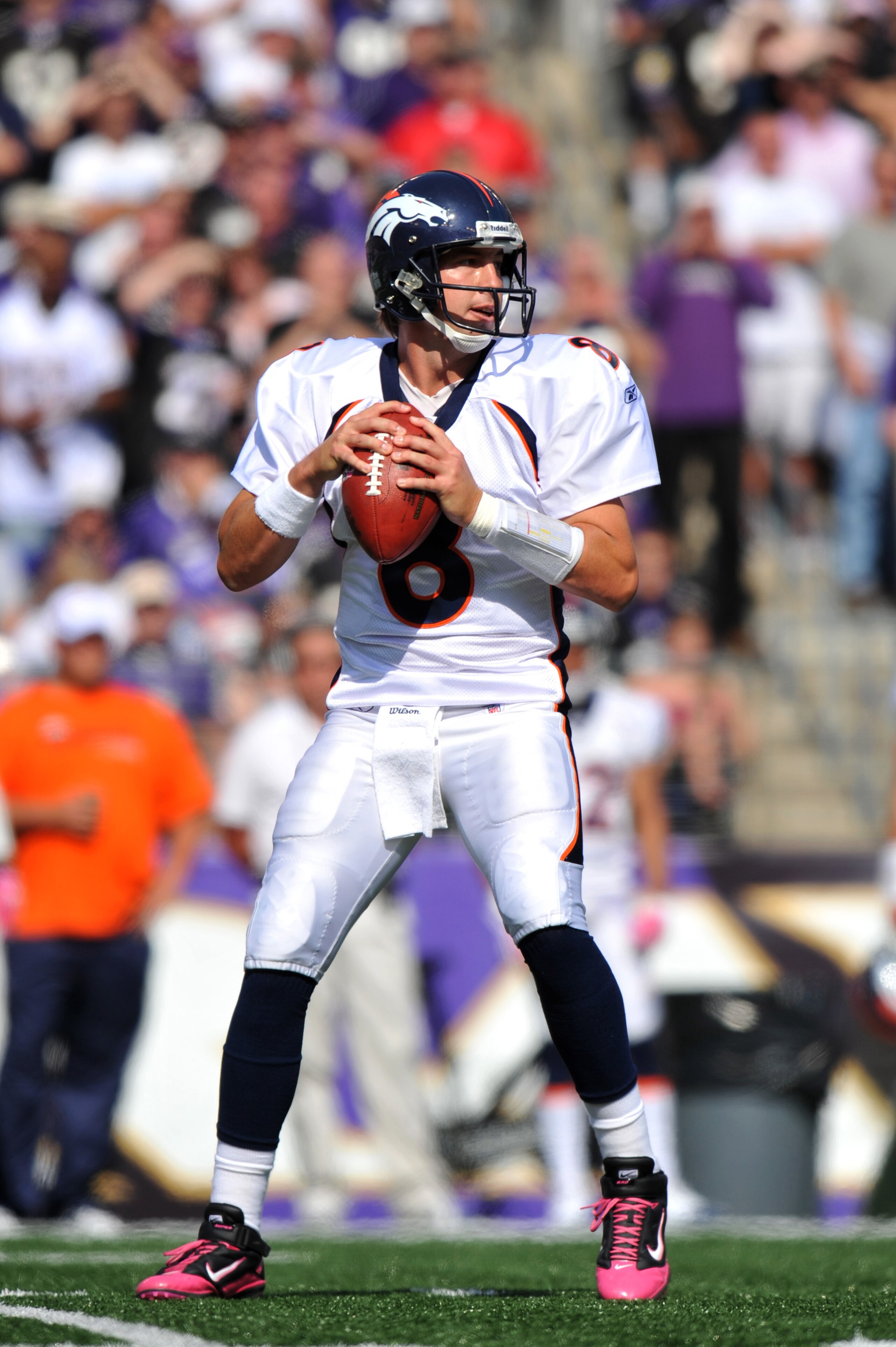 BALTIMORE, MD - OCTOBER 10: Kyle Orton #8 of the Denver Broncos passes against the Baltimore Ravens at M&T Bank Stadium on October 10, 2010 in Baltimore, Maryland. Players wore pink in recognition of Breast Cancer Awareness Month. The Ravens defeated the