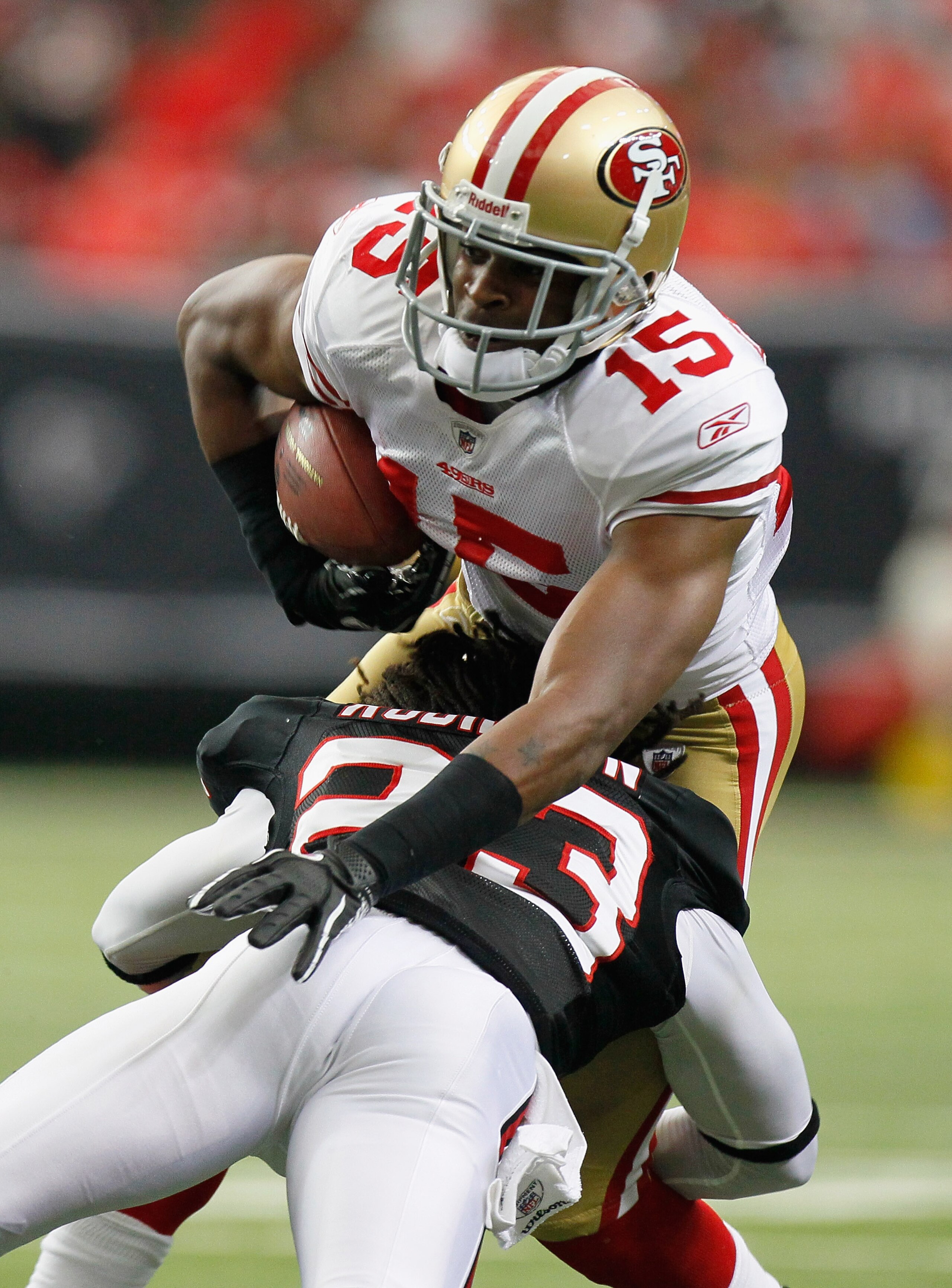 ATLANTA - OCTOBER 03:  Michael Crabtree #15 of the San Francisco 49ers against Dunta Robinson #23 of the Atlanta Falcons at Georgia Dome on October 3, 2010 in Atlanta, Georgia.  (Photo by Kevin C. Cox/Getty Images)