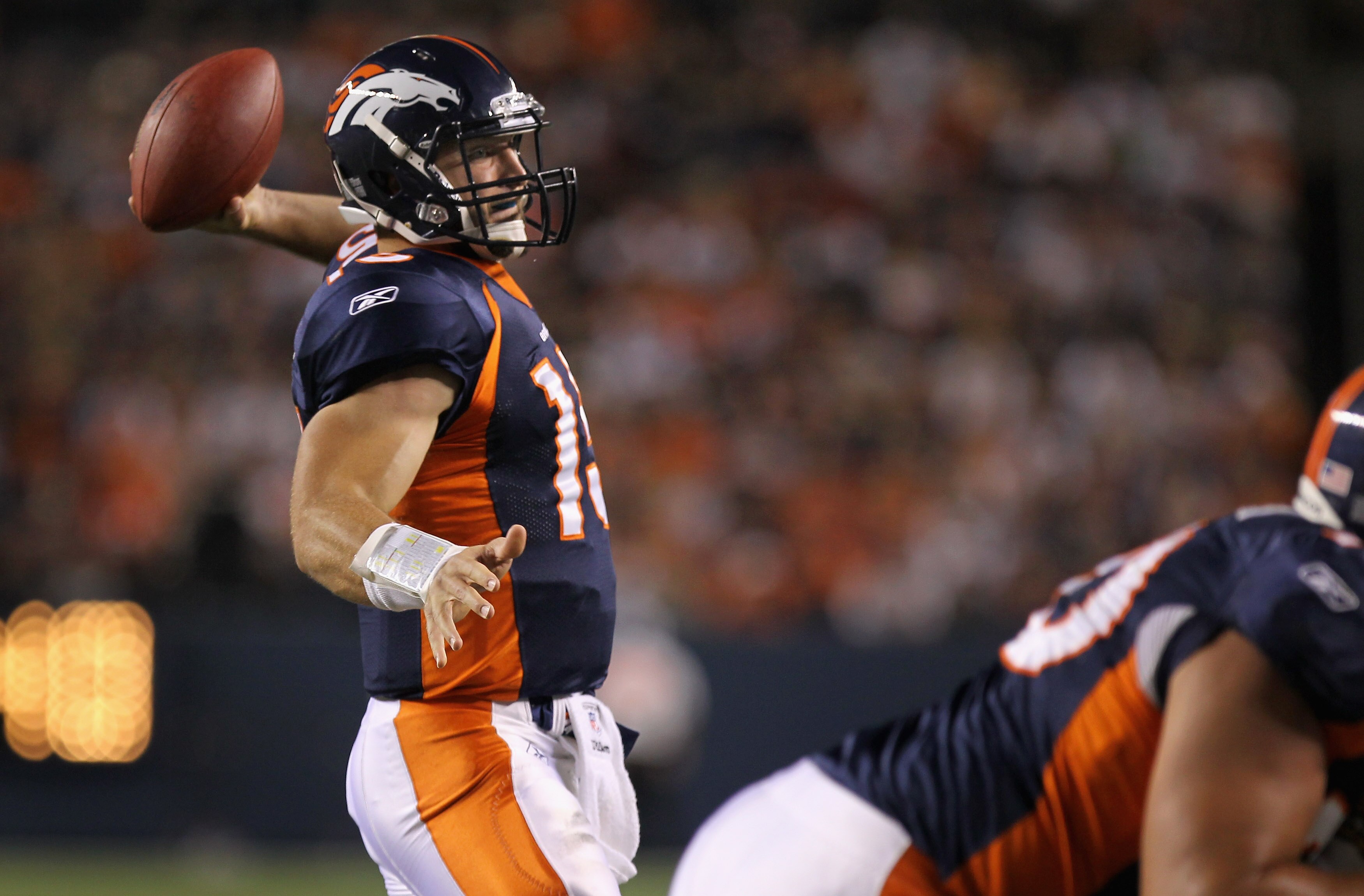 DENVER - AUGUST 29:  Quarterback Tim Tebow #15 of the Denver Broncos delivers a fourth quarter touchdown pass to Eric Decker against the Pittsburgh Steelers during preseason NFL action at INVESCO Field at Mile High on August 29, 2010 in Denver, Colorado.