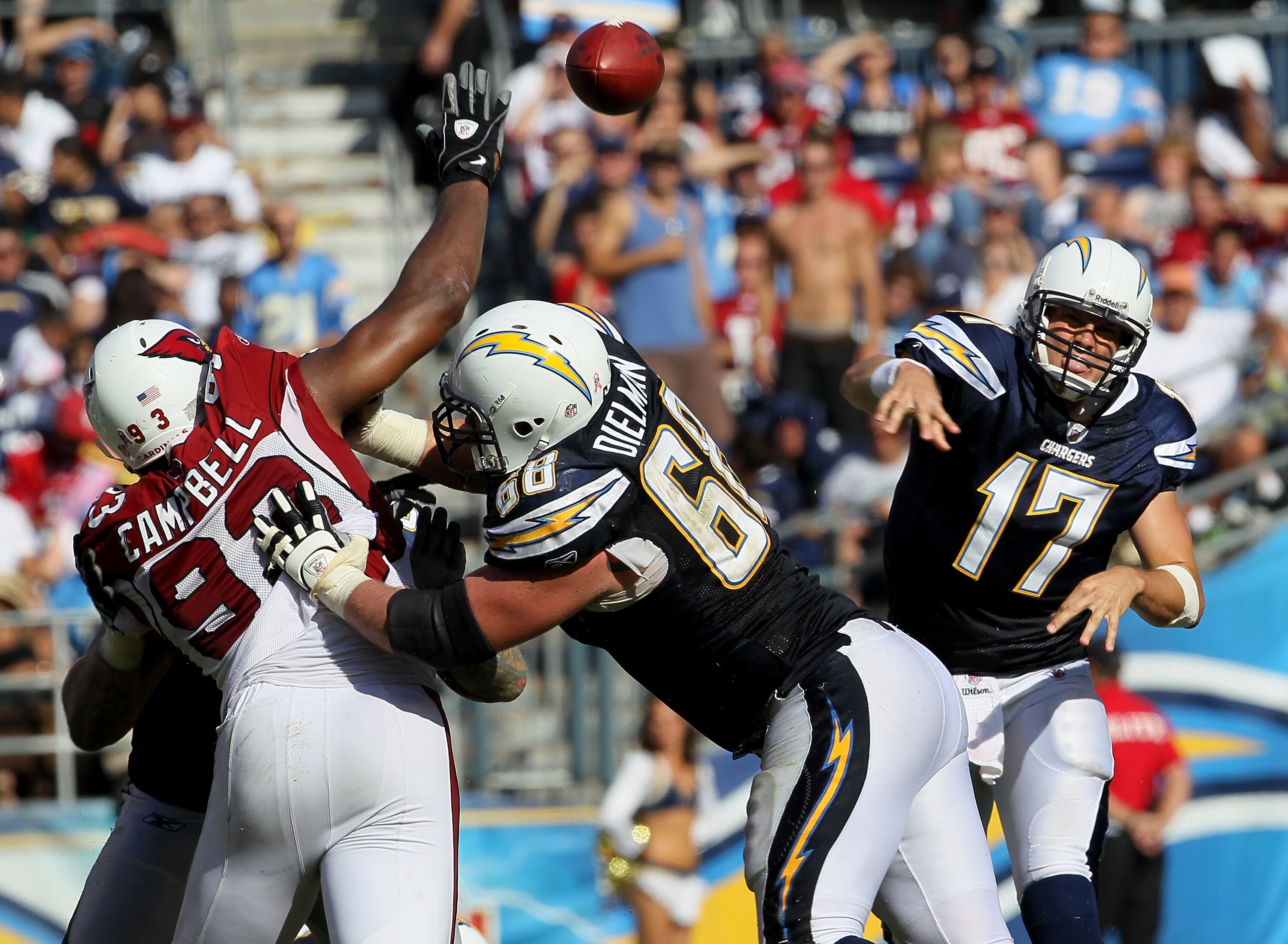 SAN DIEGO - OCTOBER 03:  Quarterback Philip Rivers of the San Diego Chargers throws a pass as guard Kris Dielman #68 blocks defensive end Calais Campbell #93 of the Arizona Cardinals at Qualcomm Stadium on October 3, 2010 in San Diego, California.   The C