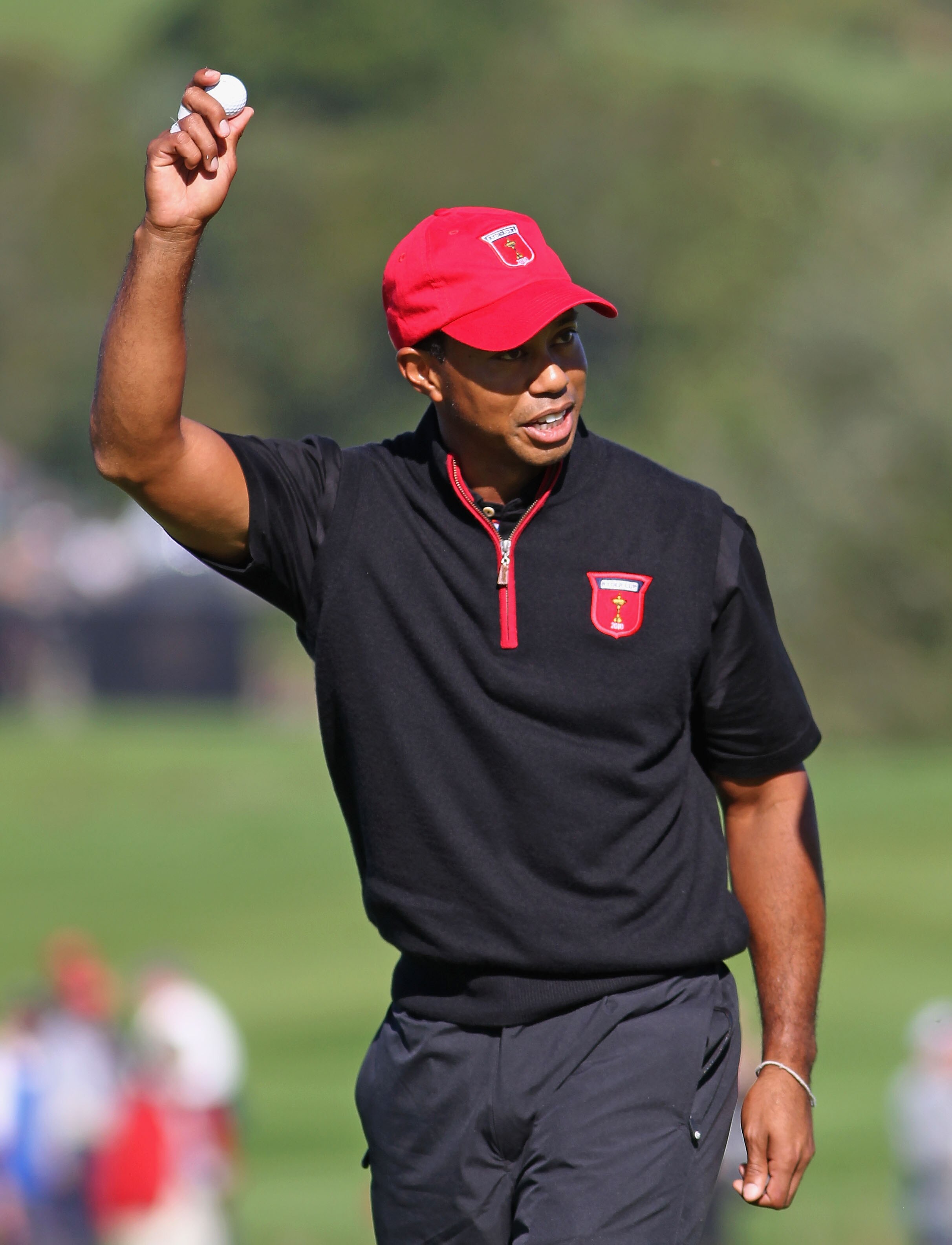 NEWPORT, WALES - OCTOBER 04:  Tiger Woods of the USA acknowledges the crowd after holing out for an eagle on the 12th hole in the singles matches during the 2010 Ryder Cup at the Celtic Manor Resort on October 4, 2010 in Newport, Wales.  (Photo by Jamie S