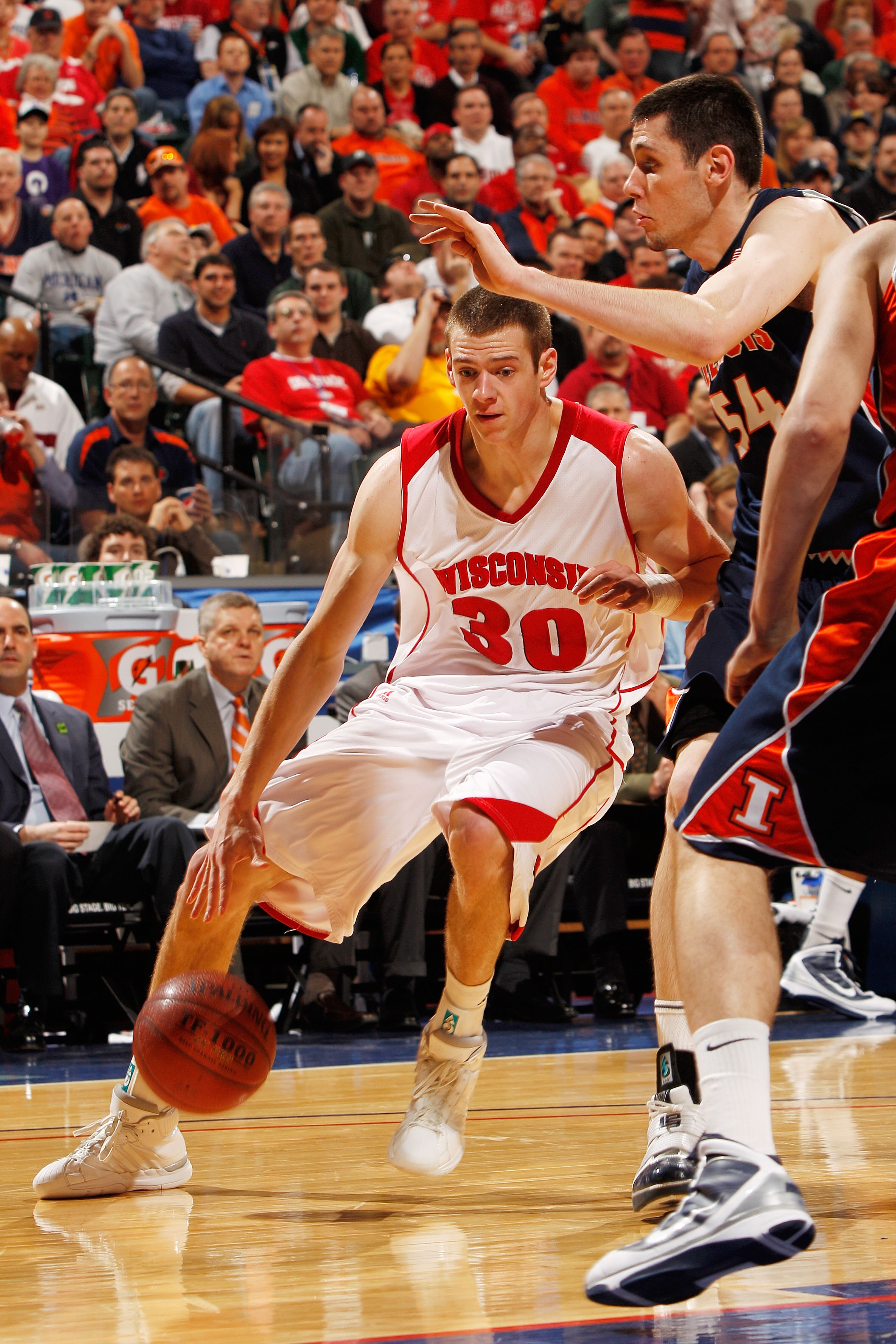 INDIANAPOLIS - MARCH 12:  Forward Jon Leuer #30 of the Wisconsin Badgers drives with the ball against the Illinois Fighting Illini during the quarterfinals of the Big Ten Men's Basketball Tournament at Conseco Fieldhouse on March 12, 2010 in Indianapolis,