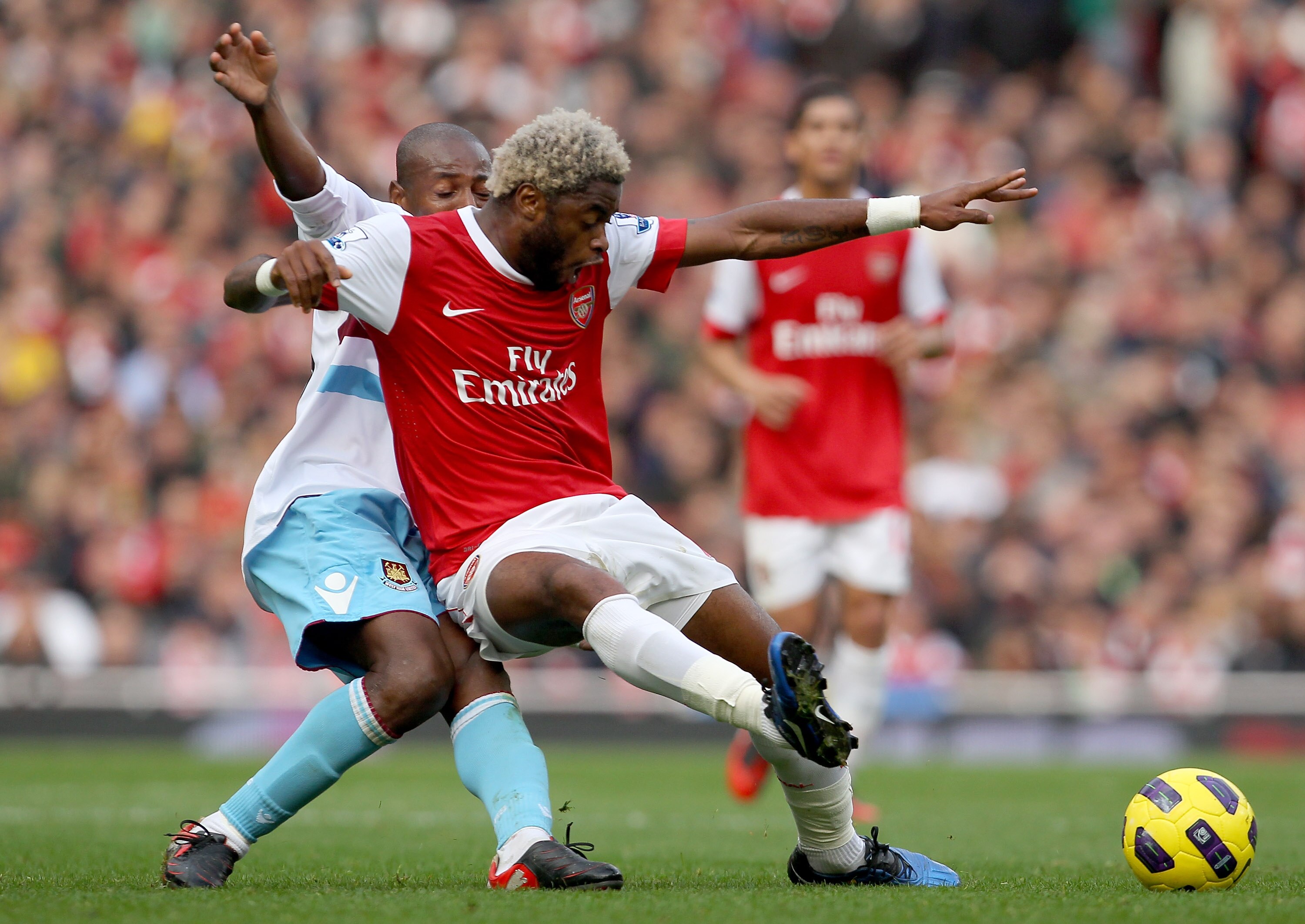 LONDON, ENGLAND - OCTOBER 30:  Alex Song of Arsenal holds off Luis Boa Morte of West Ham during the Barclays Premier League match between Arsenal and West Ham United at Emirates Stadium on October 30, 2010 in London, England.  (Photo by Clive Rose/Getty I