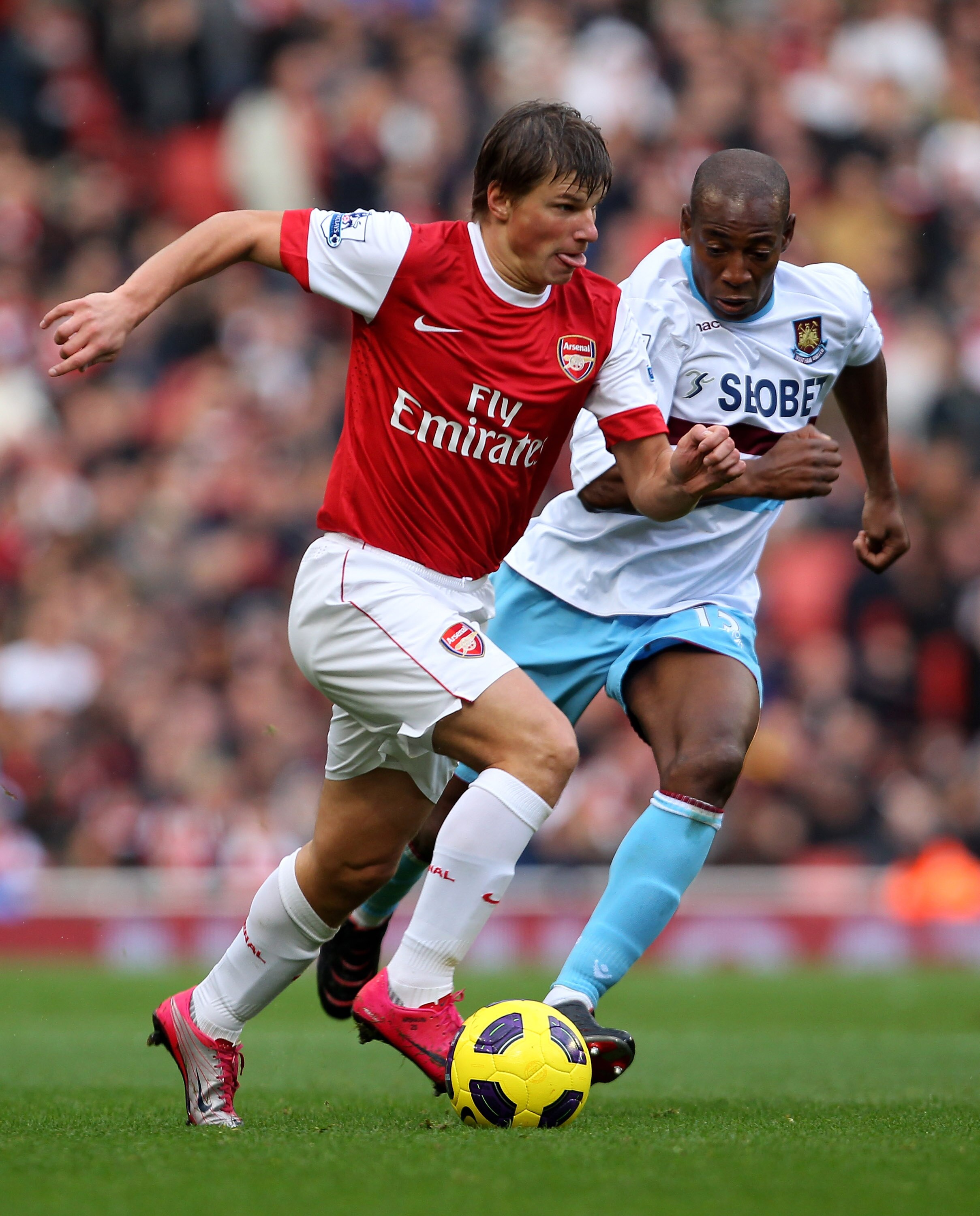 LONDON, ENGLAND - OCTOBER 30:  Andrey Arshavin of Arsenal and Luis Boa Morte of West Ham in action during the Barclays Premier League match between Arsenal and West Ham United at Emirates Stadium on October 30, 2010 in London, England.  (Photo by Clive Ro