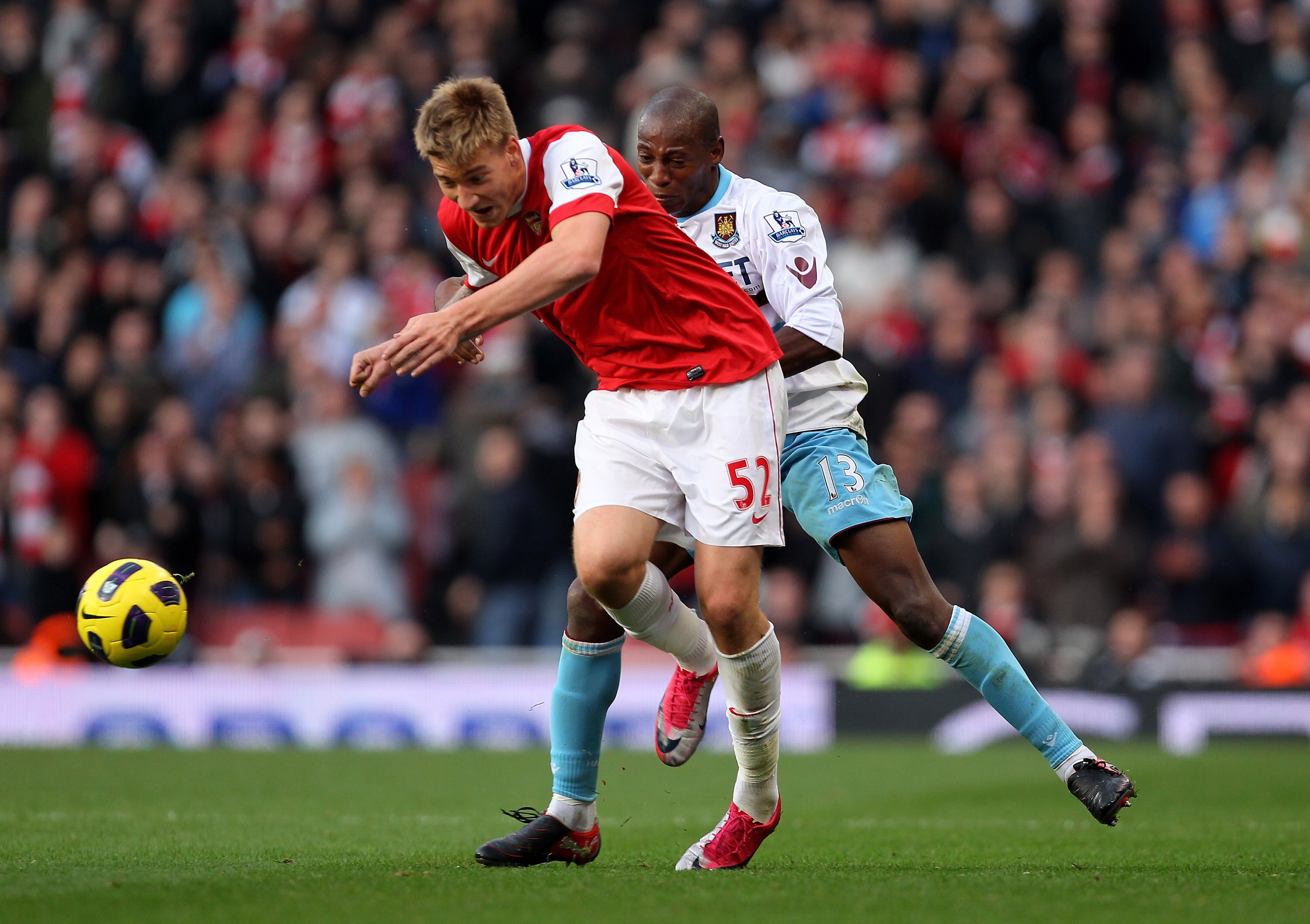 LONDON, ENGLAND - OCTOBER 30:  Luis Boa Morte of West Ham and Nicklas Bendtner of Arsenal in action during the Barclays Premier League match between Arsenal and West Ham United at Emirates Stadium on October 30, 2010 in London, England.  (Photo by Clive R