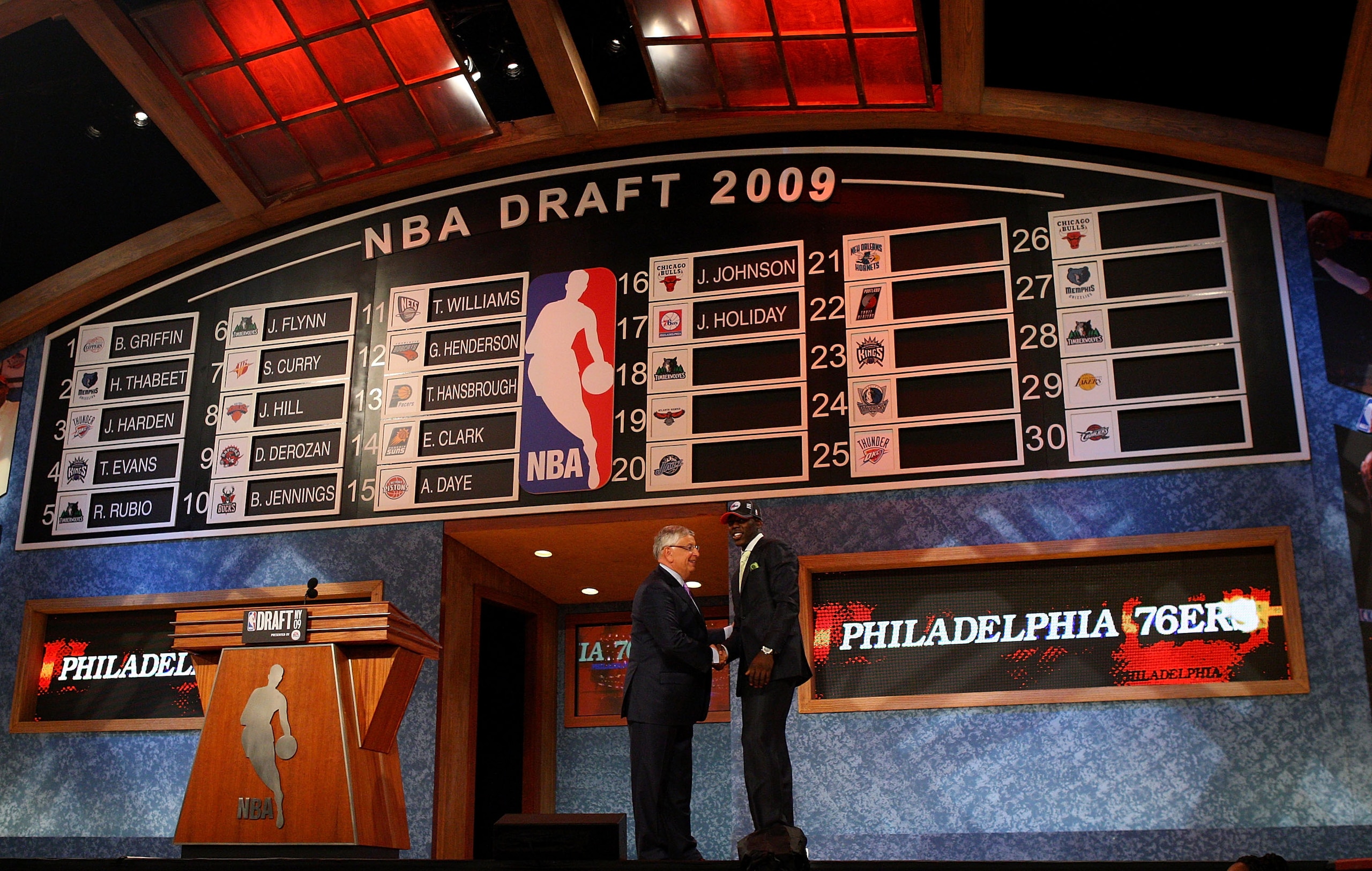NEW YORK - JUNE 25: NBA Commissioner David Stern poses for a photograph with the seventeenth overall draft pick by the Philadelphia 76ers, Jrue Holiday during the 2009 NBA Draft at the Wamu Theatre at Madison Square Garden June 25, 2009 in New York City NEW YORK - JUNE 25: NBA Commissioner David Stern poses for a photograph with the seventeenth overall draft pick by the Philadelphia 76ers, Jrue Holiday during the 2009 NBA Draft at the Wamu Theatre at Madison Square Garden June 25, 2009 in New York City