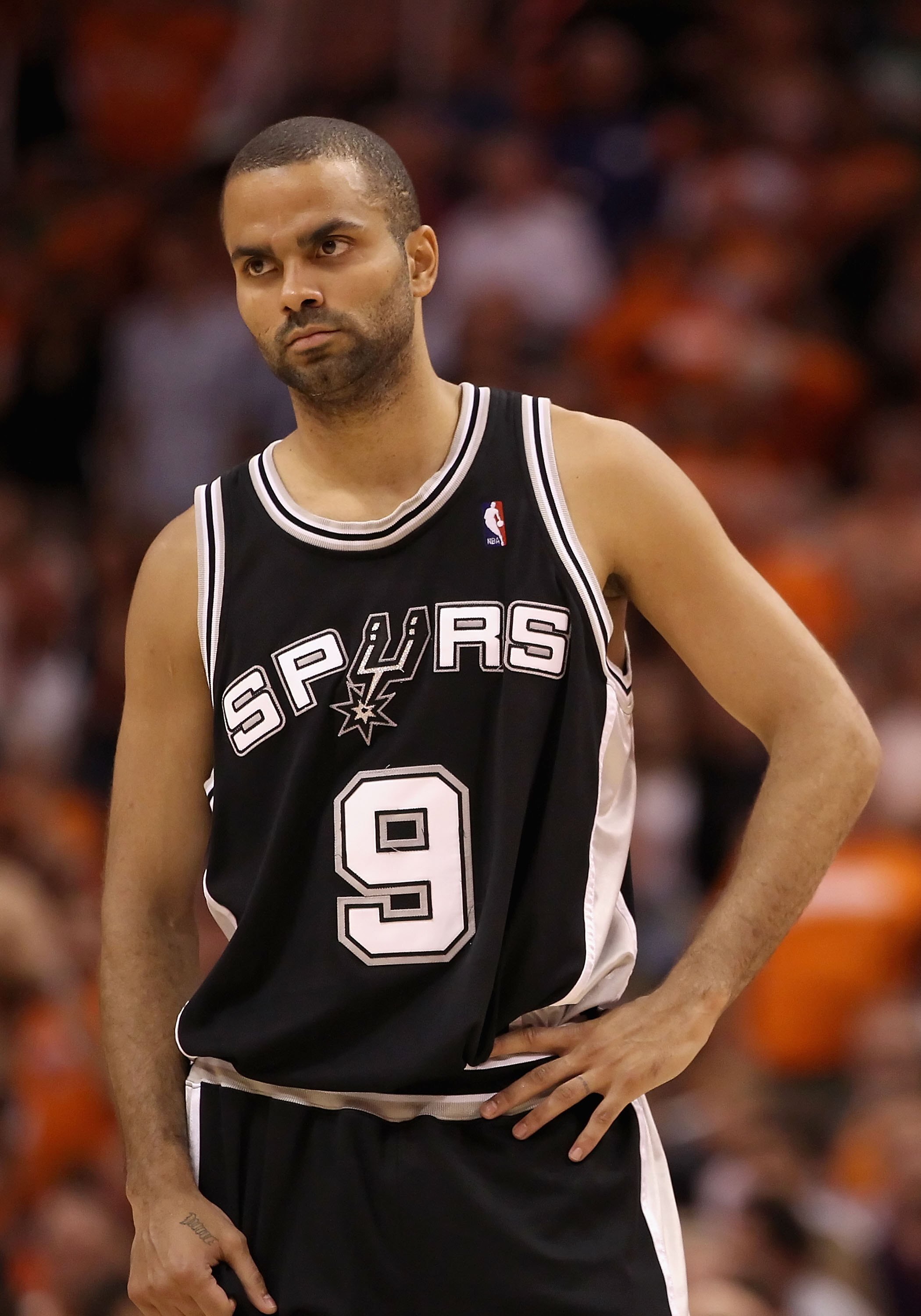 PHOENIX - MAY 05:  Tony Parker #9 of the San Antonio Spurs reacts during Game Two of the Western Conference Semifinals of the 2010 NBA Playoffs against the Phoenix Suns at US Airways Center on May 5, 2010 in Phoenix, Arizona. The team is wearing 'Los Suns