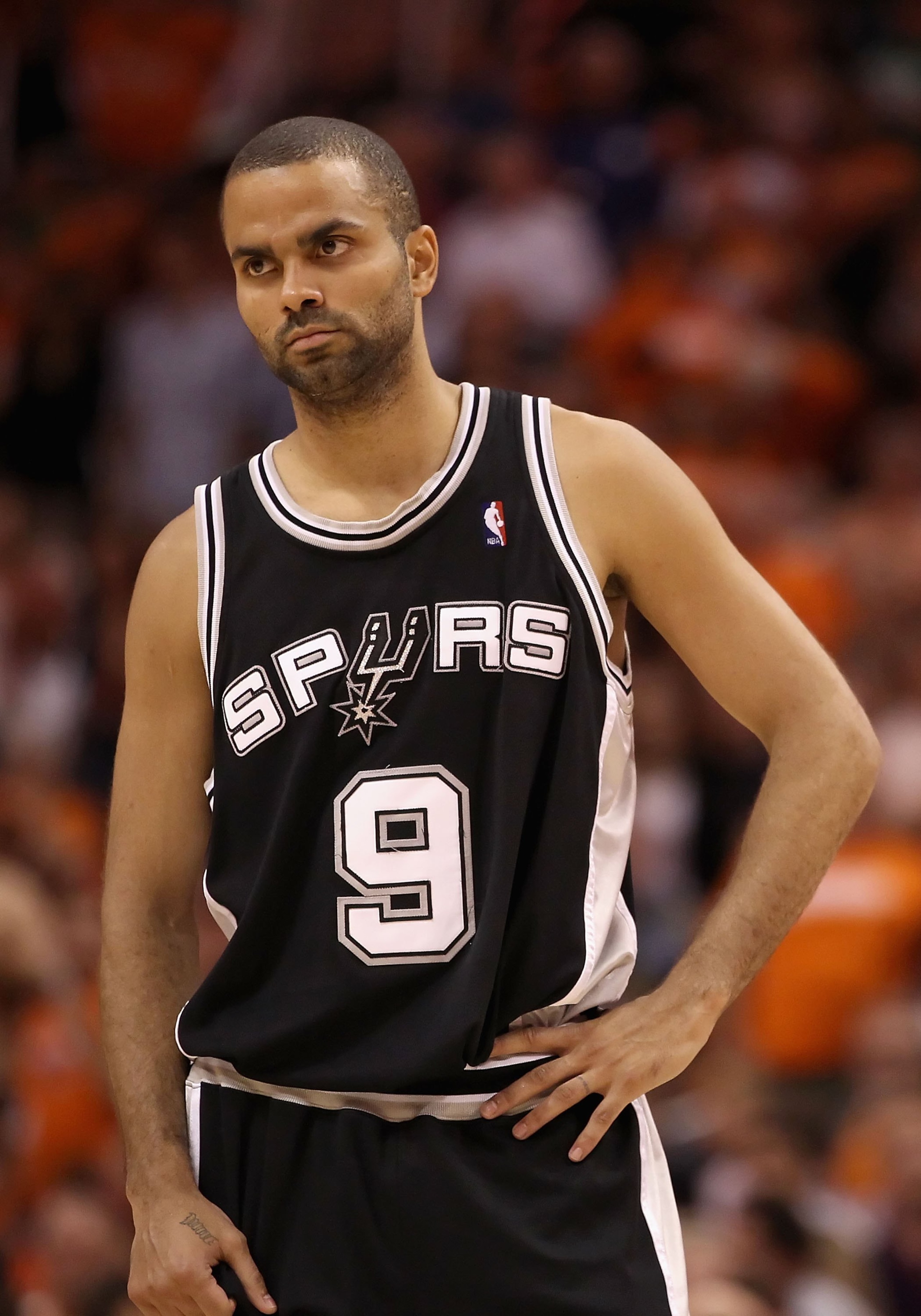 PHOENIX - MAY 05:  Tony Parker #9 of the San Antonio Spurs reacts during Game Two of the Western Conference Semifinals of the 2010 NBA Playoffs against the Phoenix Suns at US Airways Center on May 5, 2010 in Phoenix, Arizona. The team is wearing 'Los Suns