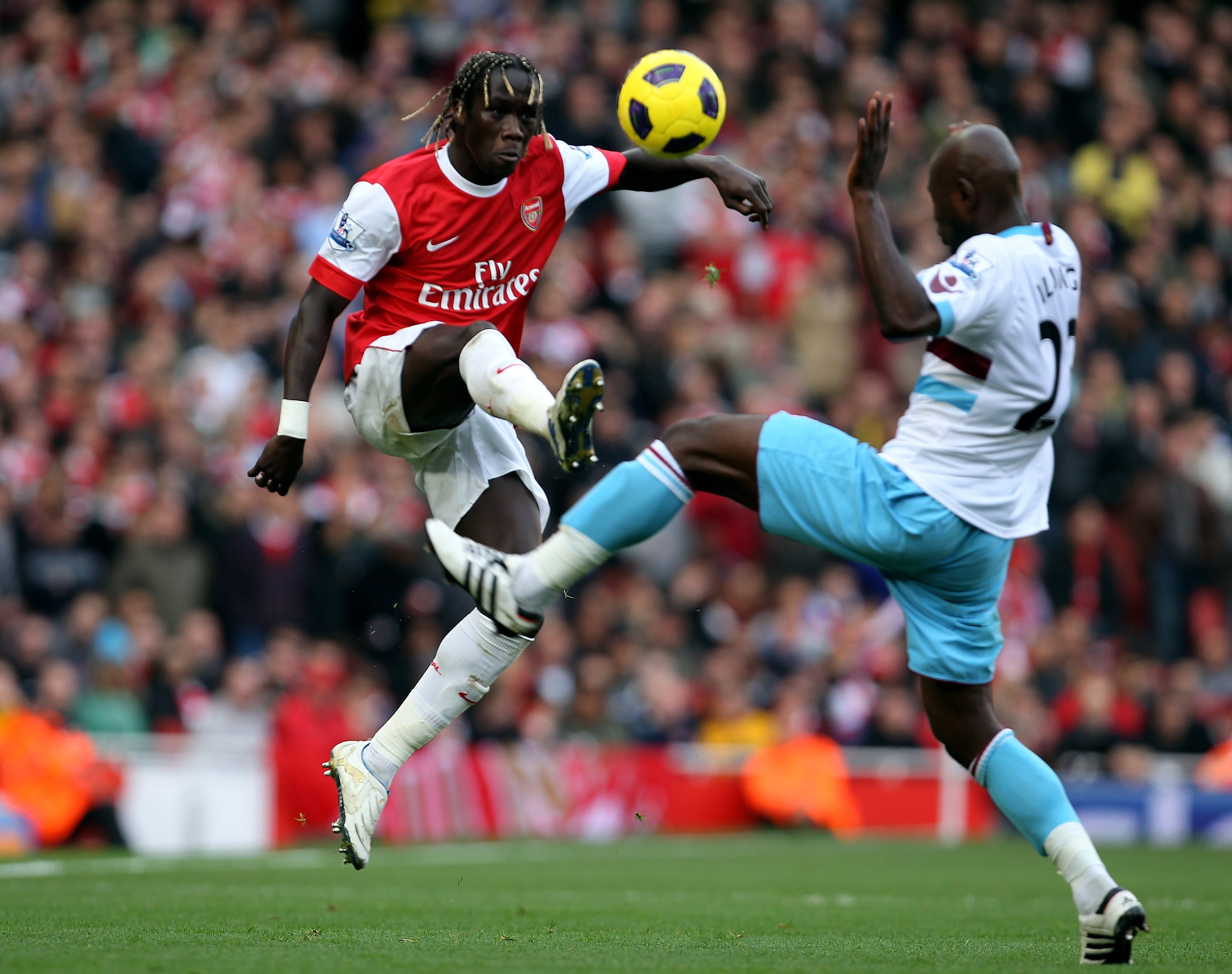 LONDON, ENGLAND - OCTOBER 30: Bacary Sagna of Arsenal and Herita Ilunga of West Ham in action during the Barclays Premier League match between Arsenal and West Ham United at Emirates Stadium on October 30, 2010 in London, England.  (Photo by Clive Rose/Ge