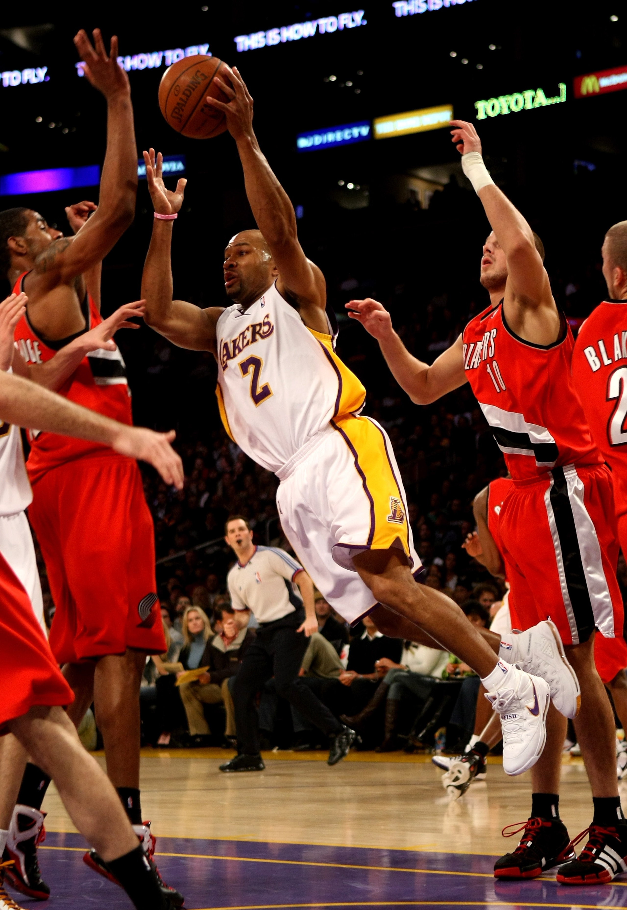 LOS ANGELES, CA - JANUARY 04: Derek Fisher #2 of  the Los Angeles Lakers passes the ball against the Portland Trail Blazers on January 4, 2009 at Staples Center in Los Angeles, California.  The Lakers won 100-86.   NOTE TO USER: User expressly acknowledge