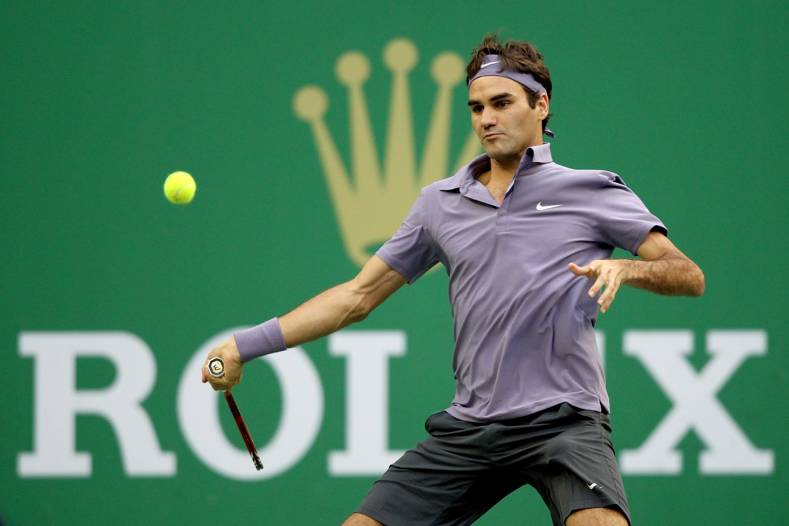 SHANGHAI, CHINA - OCTOBER 17:  Roger Federer of Switzerland returns a shot to Andy Murray of Great Britain during the final on day seven of the 2010 Shanghai Rolex Masters at the Shanghai Qi Zhong Tennis Center on October 17, 2010 in Shanghai, China.  (Ph