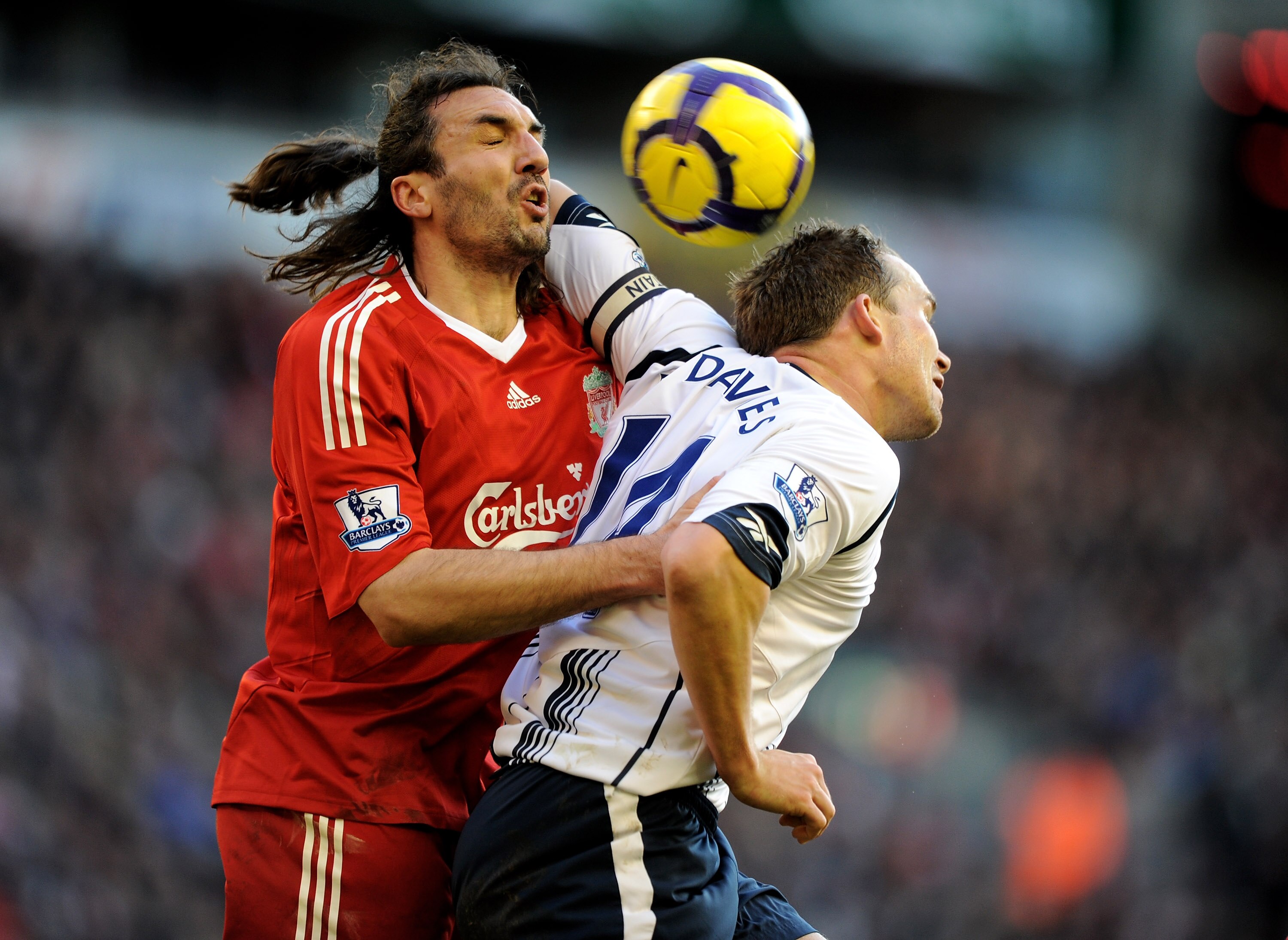 LIVERPOOL, ENGLAND - JANUARY 30: Kevin Davies of Bolton battles with Sotirios Kyrgiakos of Liverpool during the Barclays Premier League match between Liverpool and Bolton Wanderers at Anfield on January 30, 2010 in Liverpool, England.  (Photo by Laurence