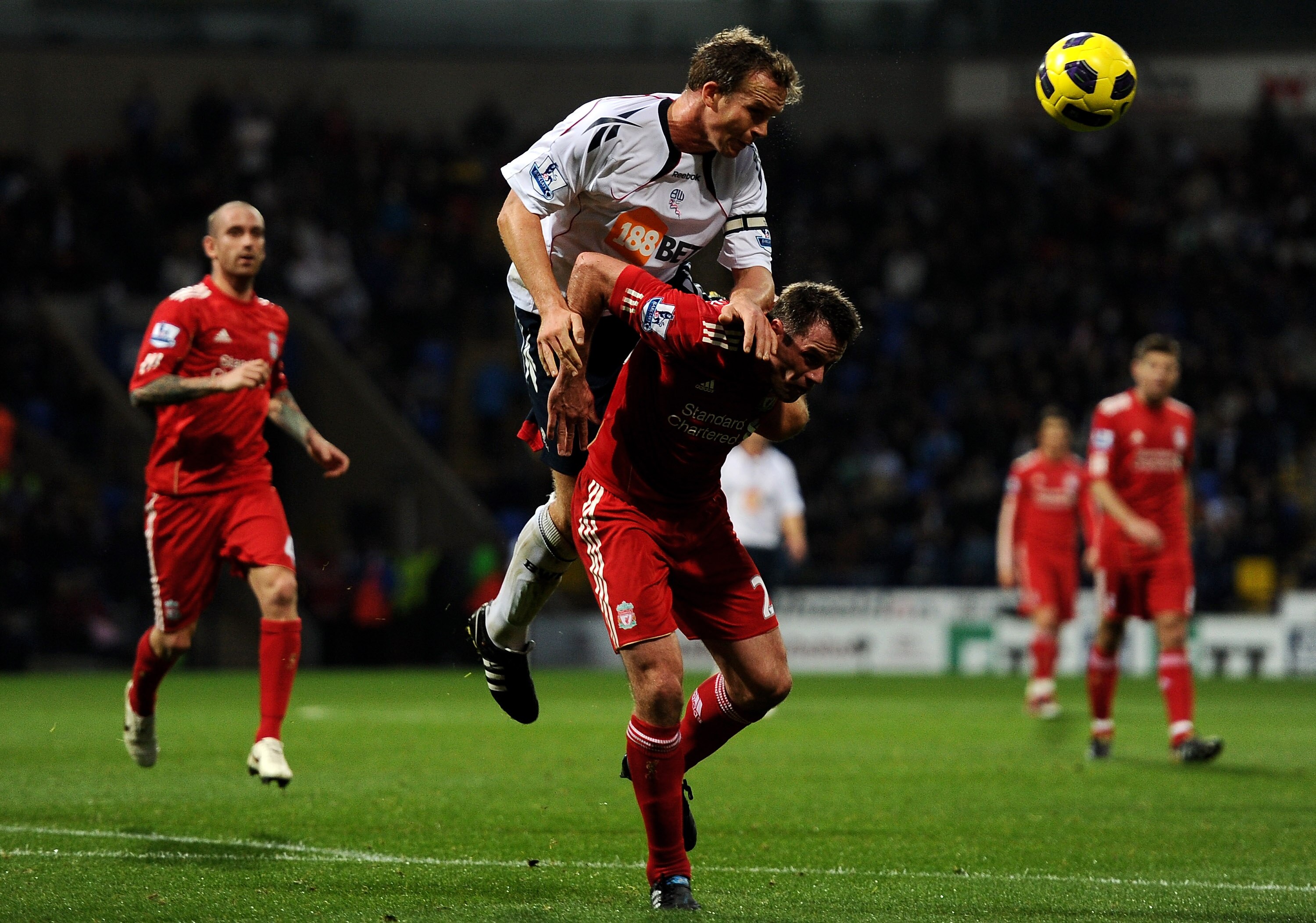 BOLTON, ENGLAND - OCTOBER 31:  Kevin Davies of Bolton Wanderers competes for the ball with Jamie Carragher of Liverpool during the Barclays Premier League match between Bolton Wanderers and Liverpool at the Reebok Stadium on October 31, 2010 in Bolton, En