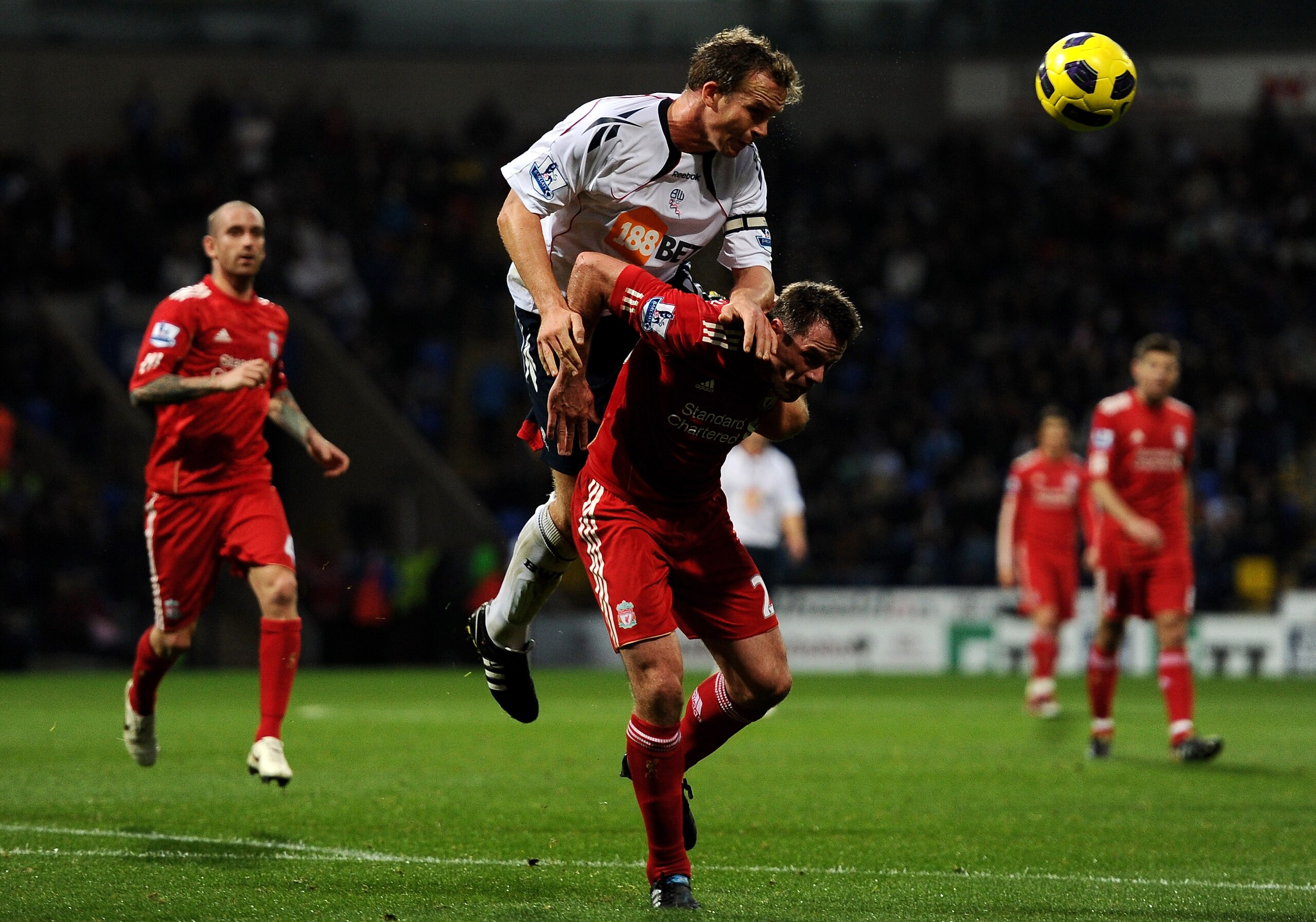 BOLTON, ENGLAND - OCTOBER 31:  Kevin Davies of Bolton Wanderers competes for the ball with Jamie Carragher of Liverpool during the Barclays Premier League match between Bolton Wanderers and Liverpool at the Reebok Stadium on October 31, 2010 in Bolton, En