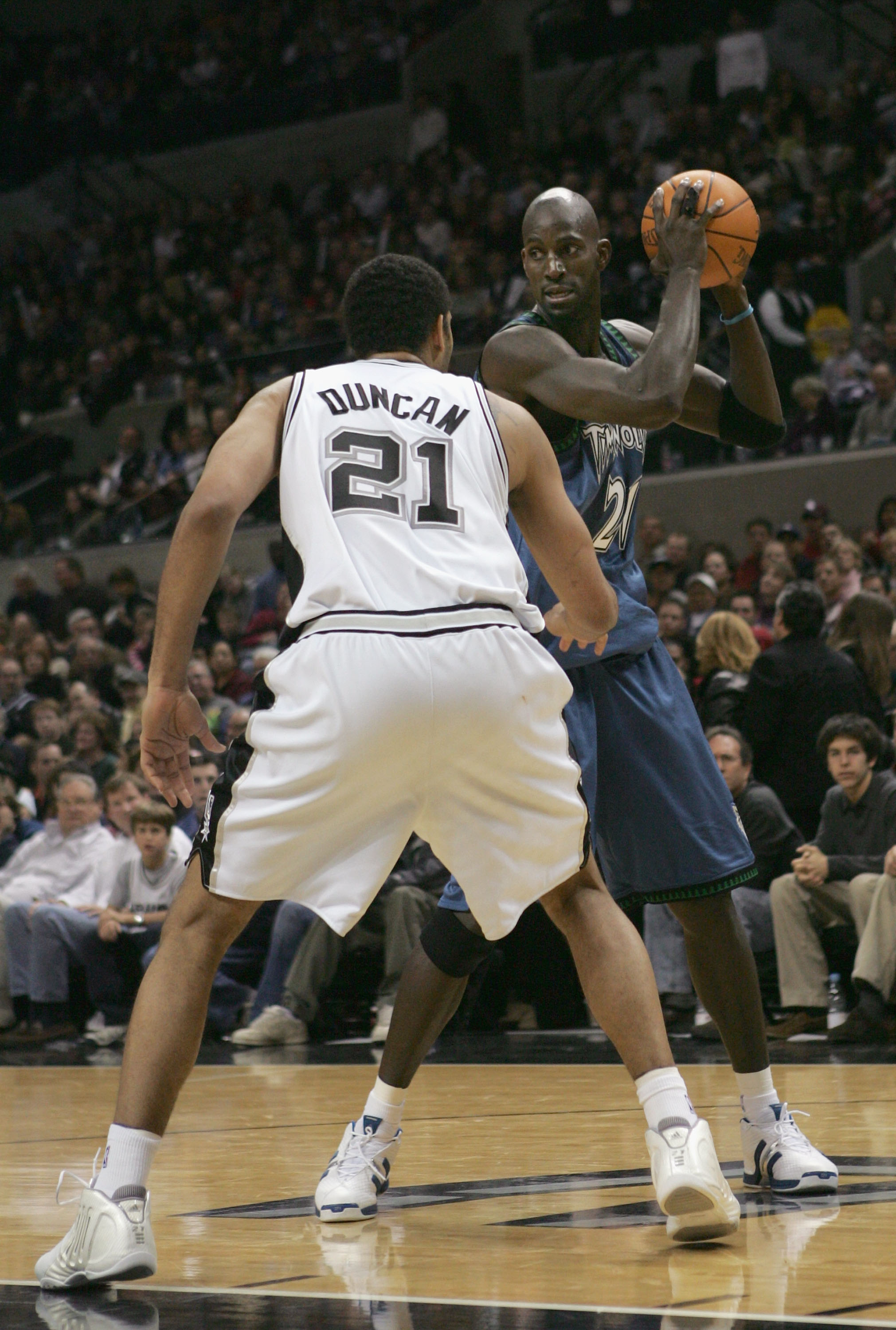 SAN ANTONIO, TX - DECEMBER 23:  Kevin Garnett #21 of the Minnesota Timberwolves is defended by Tim Duncan #21 of the San Antonio Spurs during the game on December 23, 2004 at the SBC Center in San Antonio, Texas.   The Spurs defeated the Timberwolves 96-8