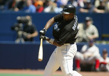 TORONTO - MAY 16:  Carlos Delgado #25 of the Toronto Blue Jays swings at a pitch during the game against the Boston Red Sox on May 16, 2004 at Skydome in Toronto, Ontario, Canada.  The Blue Jays won 3-1.  (Photo by Rick Stewart/Getty Images)