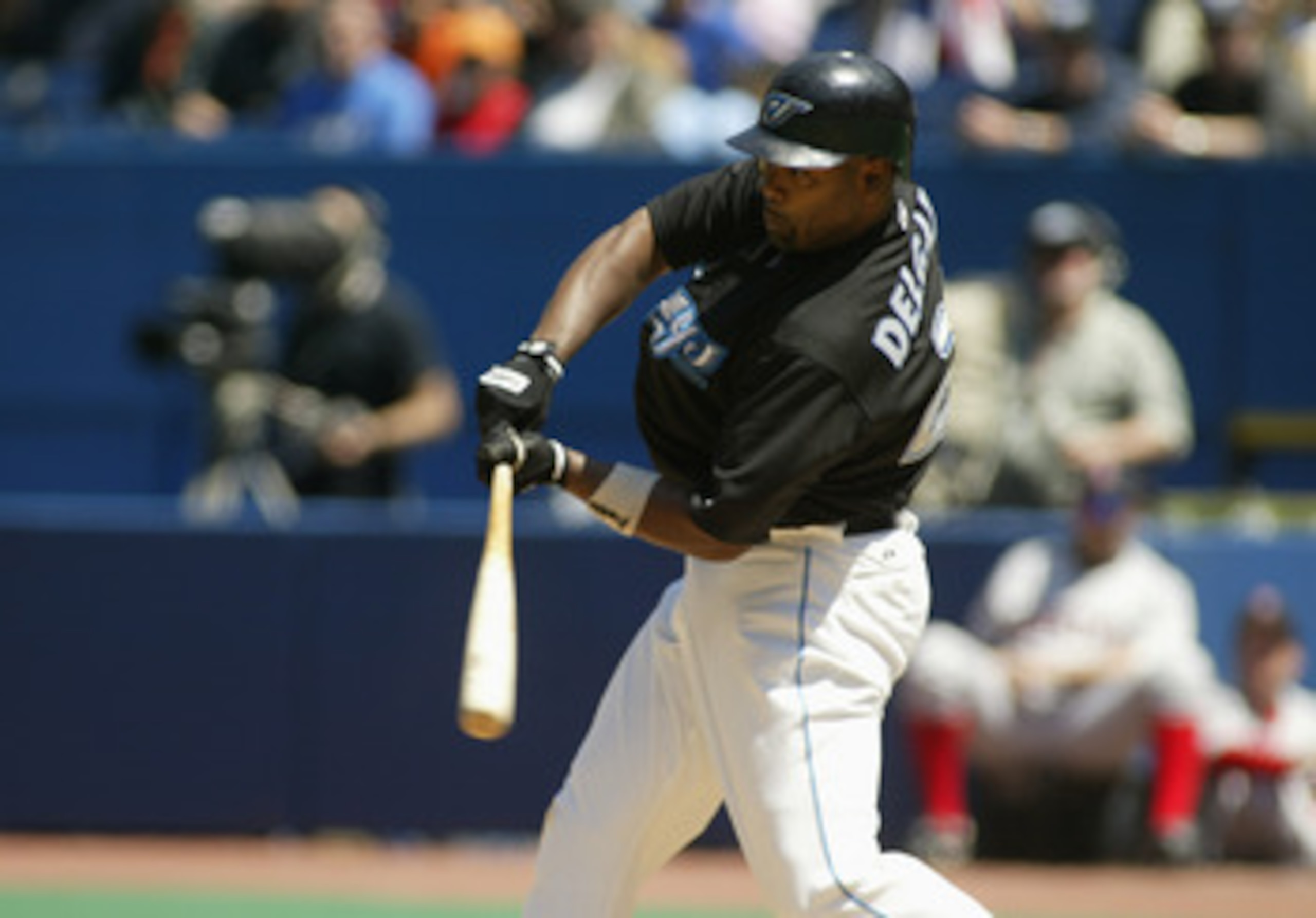 TORONTO - MAY 16:  Carlos Delgado #25 of the Toronto Blue Jays swings at a pitch during the game against the Boston Red Sox on May 16, 2004 at Skydome in Toronto, Ontario, Canada.  The Blue Jays won 3-1.  (Photo by Rick Stewart/Getty Images)