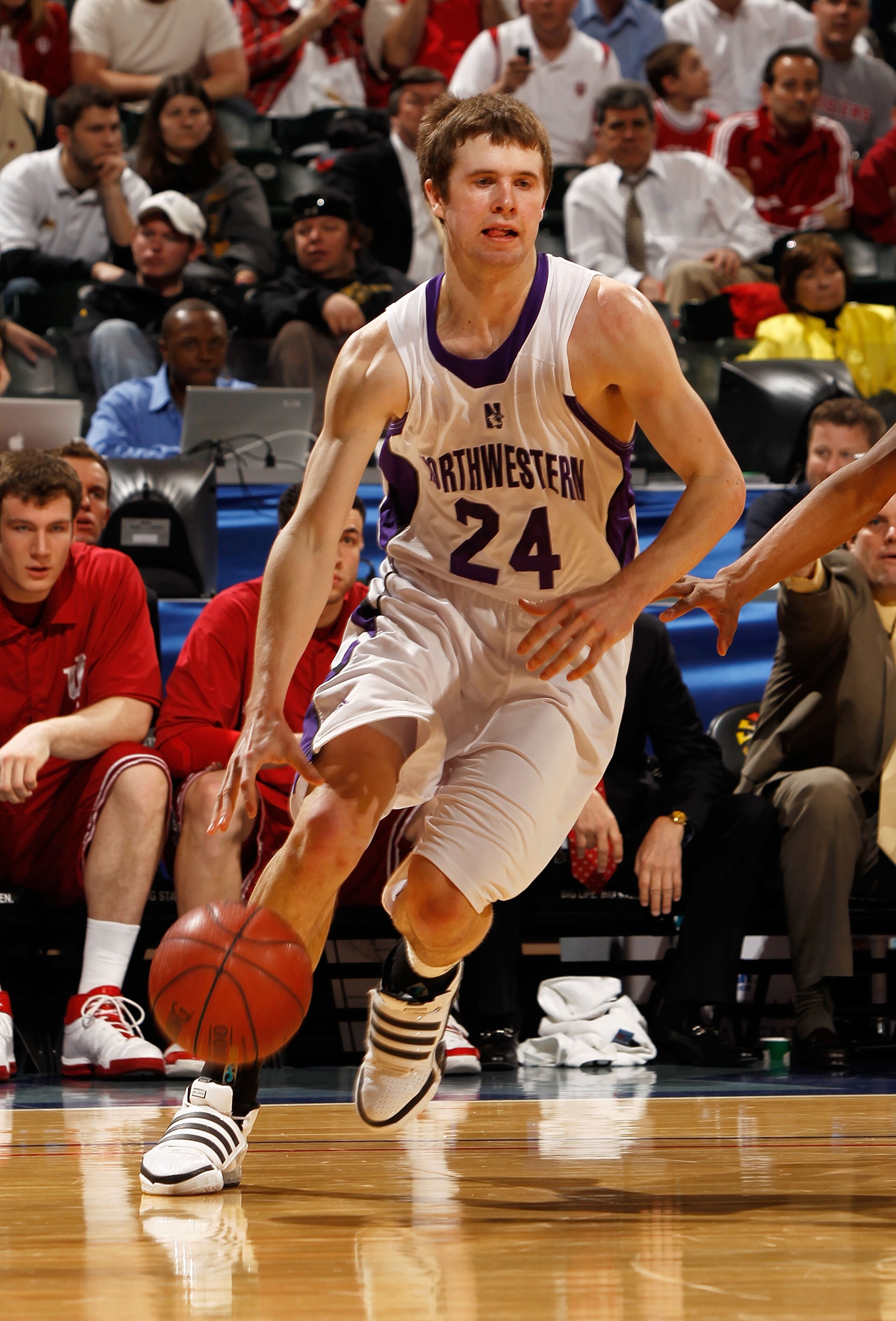 INDIANAPOLIS - MARCH 11:  Forward John Shurna #24 of the Northwestern Wildcats drives with the ball against the Indiana Hoosiers during the first round of the Big Ten Men's Basketball Tournament at Conseco Fieldhouse on March 11, 2010 in Indianapolis, Ind
