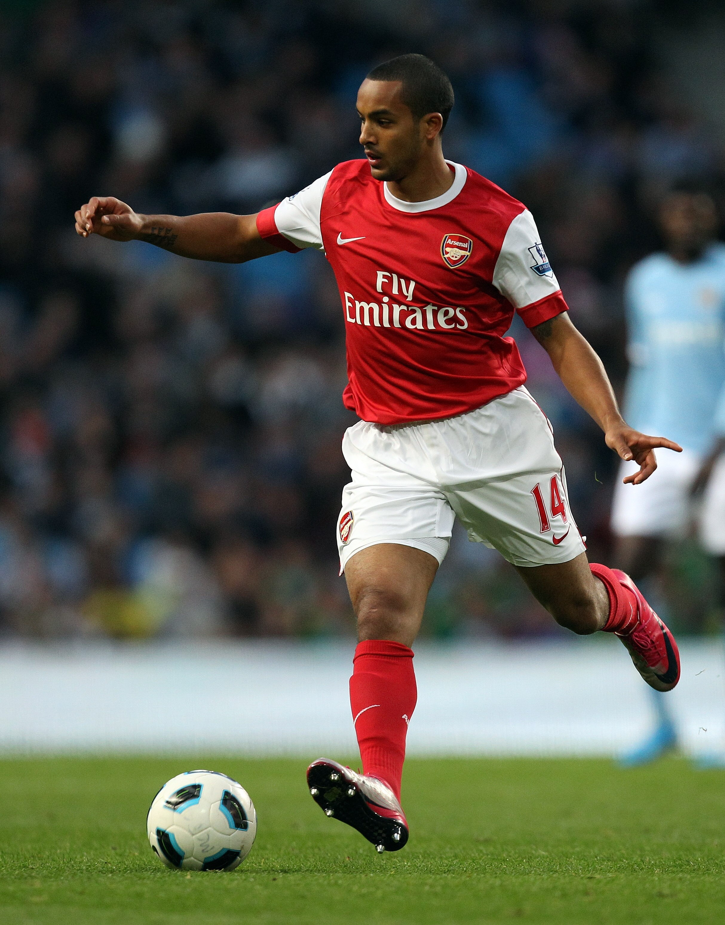MANCHESTER, ENGLAND - OCTOBER 24:  Theo Walcott of Arsenal in action during the Barclays Premier League match between Manchester City and Arsenal at City of Manchester Stadium on October 24, 2010 in Manchester, England.  (Photo by Richard Heathcote/Getty