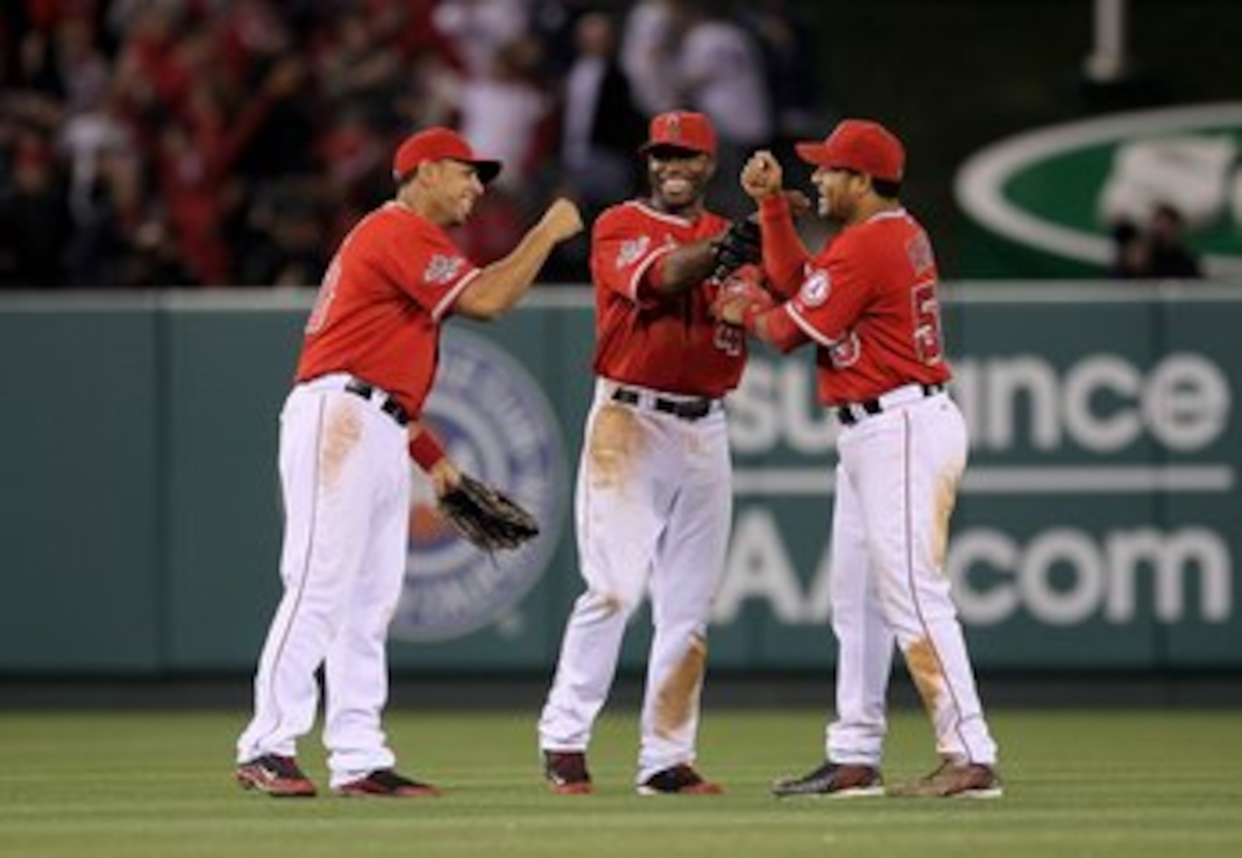 ANAHEIM, CA - APRIL 23: Outfielders Bobby Abreu #53, Torii Hunter #48, and Juan Rivera #20 (R to L) of the Los Angeles Angels of Anaheim celebrate after the game against the New York Yankees on April 23, 2010 at Angel Stadium in Anaheim, California.  (Pho