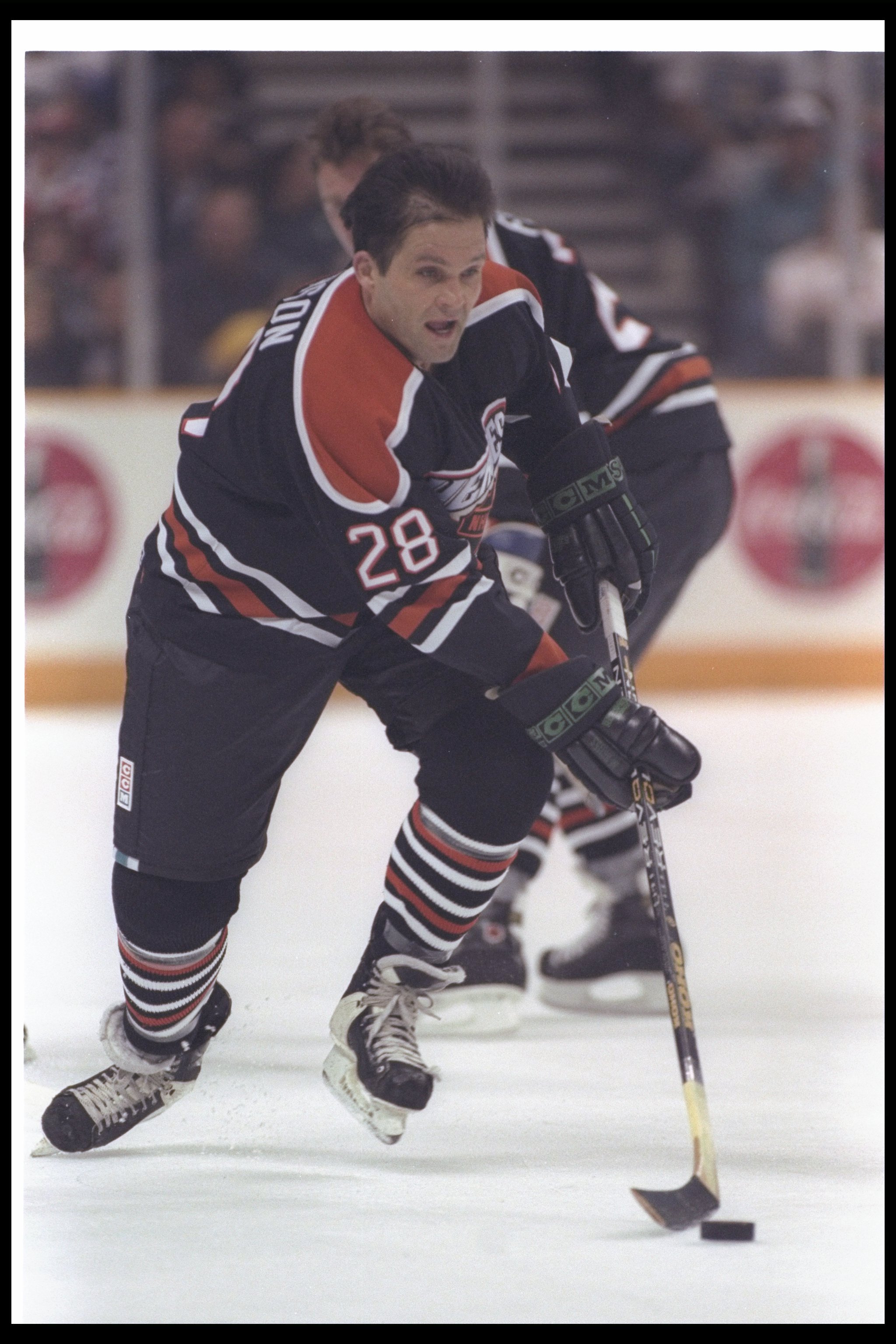 17 Jan 1997:  Reed Larson of the NHL moves the puck during the Heroes of Hockey game against California at the San Jose Arena in San Jose, California.  The NHL won the game, 4-3. Mandatory Credit: Jamie Squire  /Allsport
