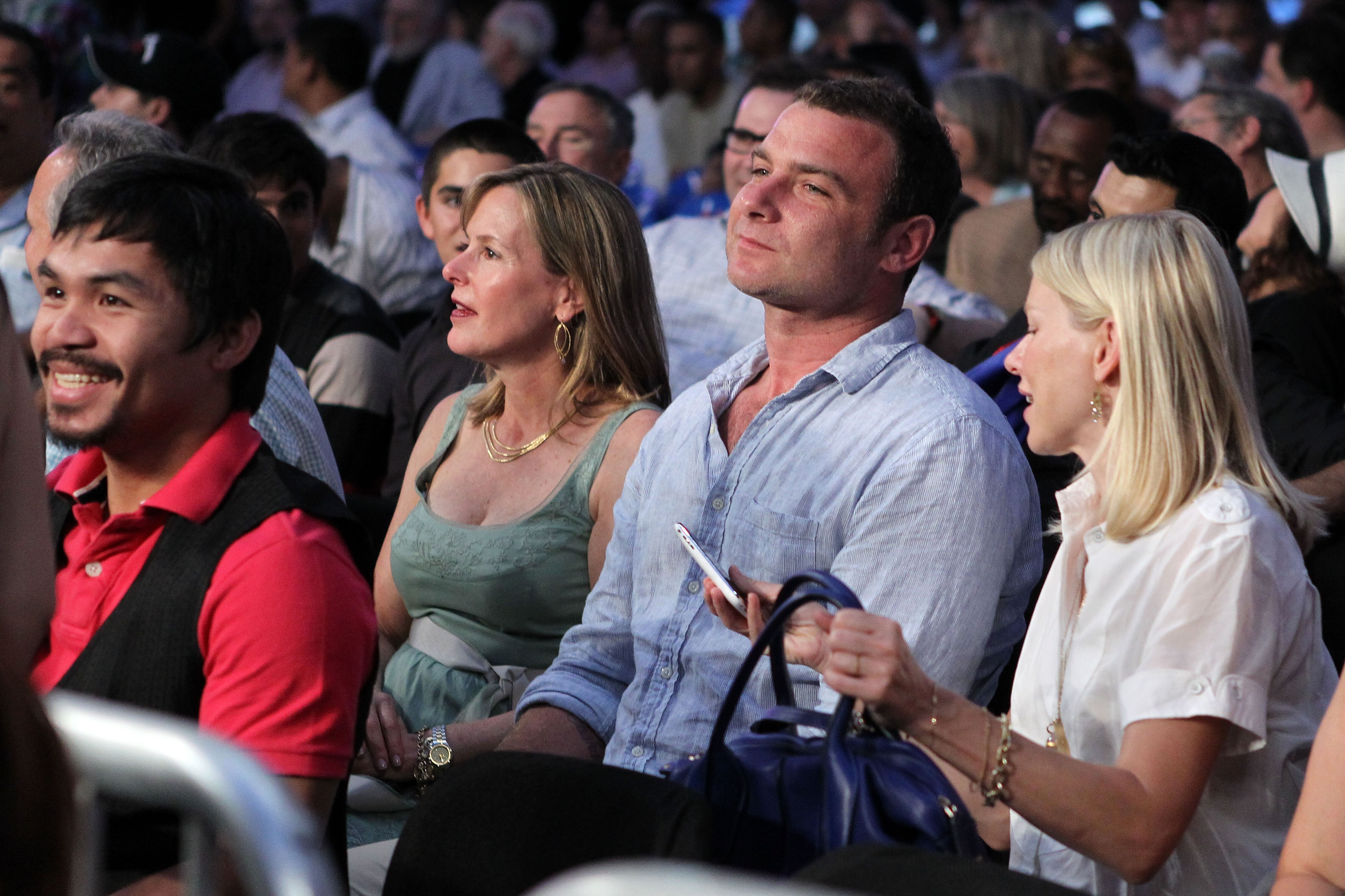 NEW YORK - JUNE 05:  (L-R) Professional boxer Manny Pacquiao, actor Liev Schreiber and actress Naomi Watts watch the bout between James Moore and Pawel Wolak during the super welterweight fight on June 5, 2010 at Yankee Stadium in the Bronx borough of New