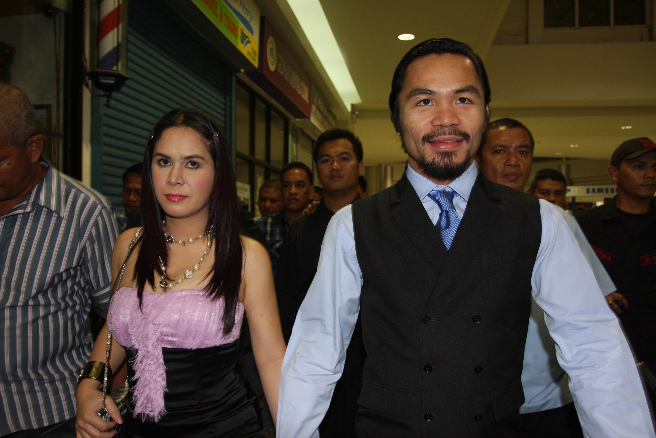 GENERAL SANTOS, PHILIPPINES - MAY 15:  World welterweight boxing champion Manny Pacquiao and wife Jinkee Pacquiao arrive at the KCC Mall on May 15, 2010 in General Santos, Philippines. Pacquiao was there to celebrate his election on becoming a member of H