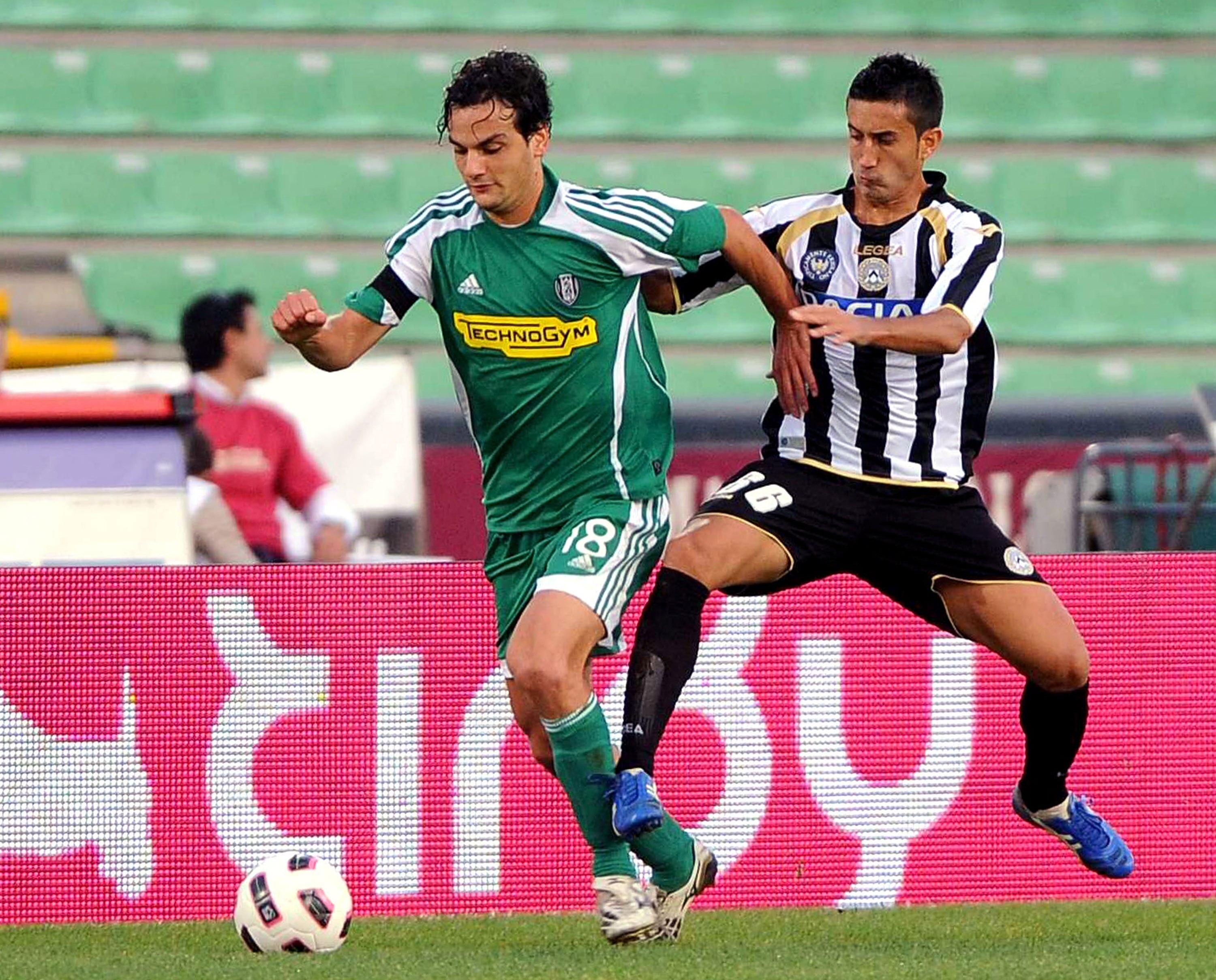UDINE, ITALY - OCTOBER 02: Marco Parolo of Cesena competes with Giampiero Pinzi during the Serie A match between Udinese Calcio and AC Cesena at Stadio Friuli on October 2, 2010 in Udine, Italy.  (Photo by Roberto Serra/Getty Images)