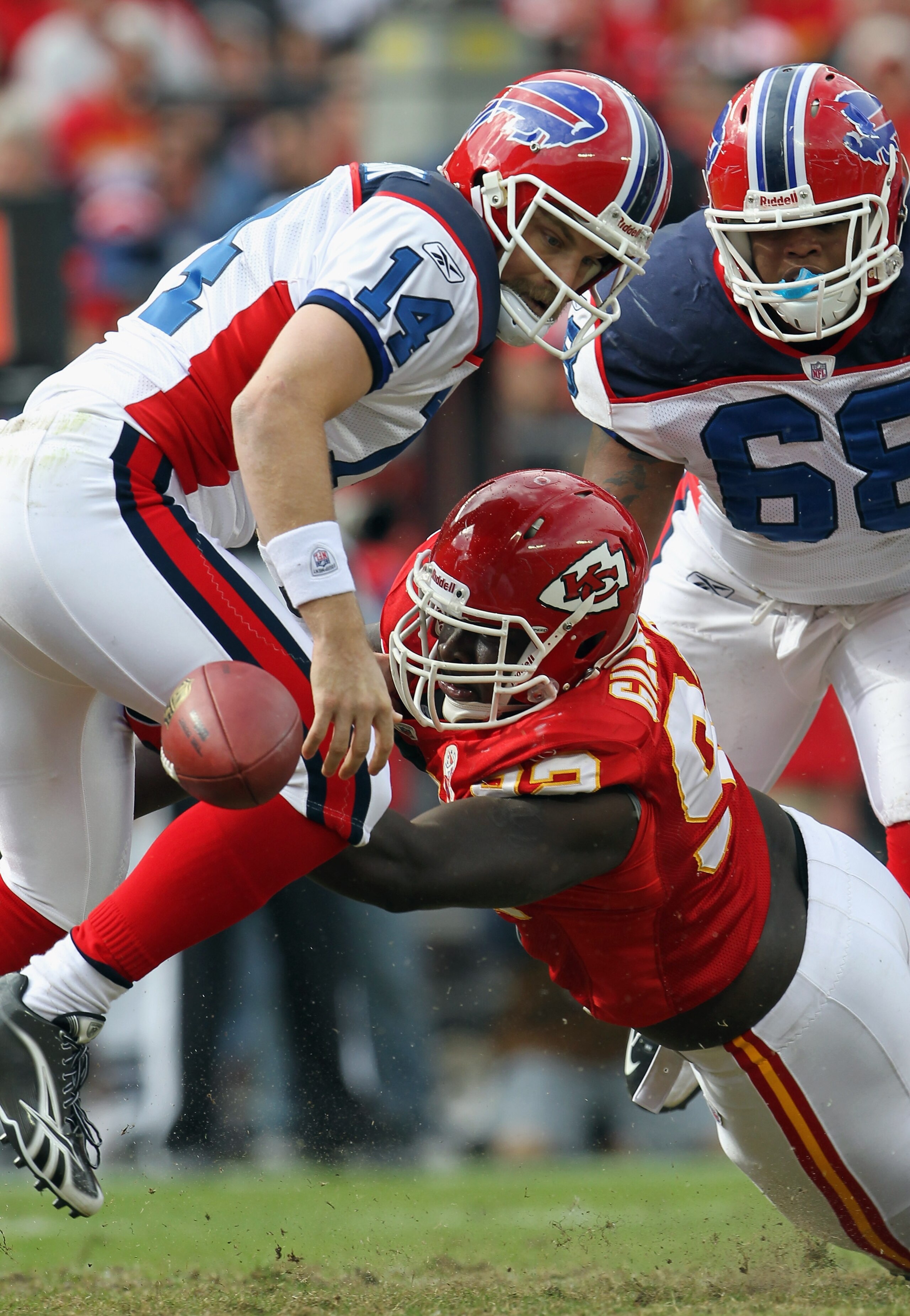 KANSAS CITY, MO - OCTOBER 31:  Wallace Gilberry #92 of the Kansas City Chiefs strips the ball from the hands of quarterback Ryan Fitzpatrick #14 of the Buffalo Bills during the game on October 31, 2010  at Arrowhead Stadium in Kansas City, Missouri.  (Pho