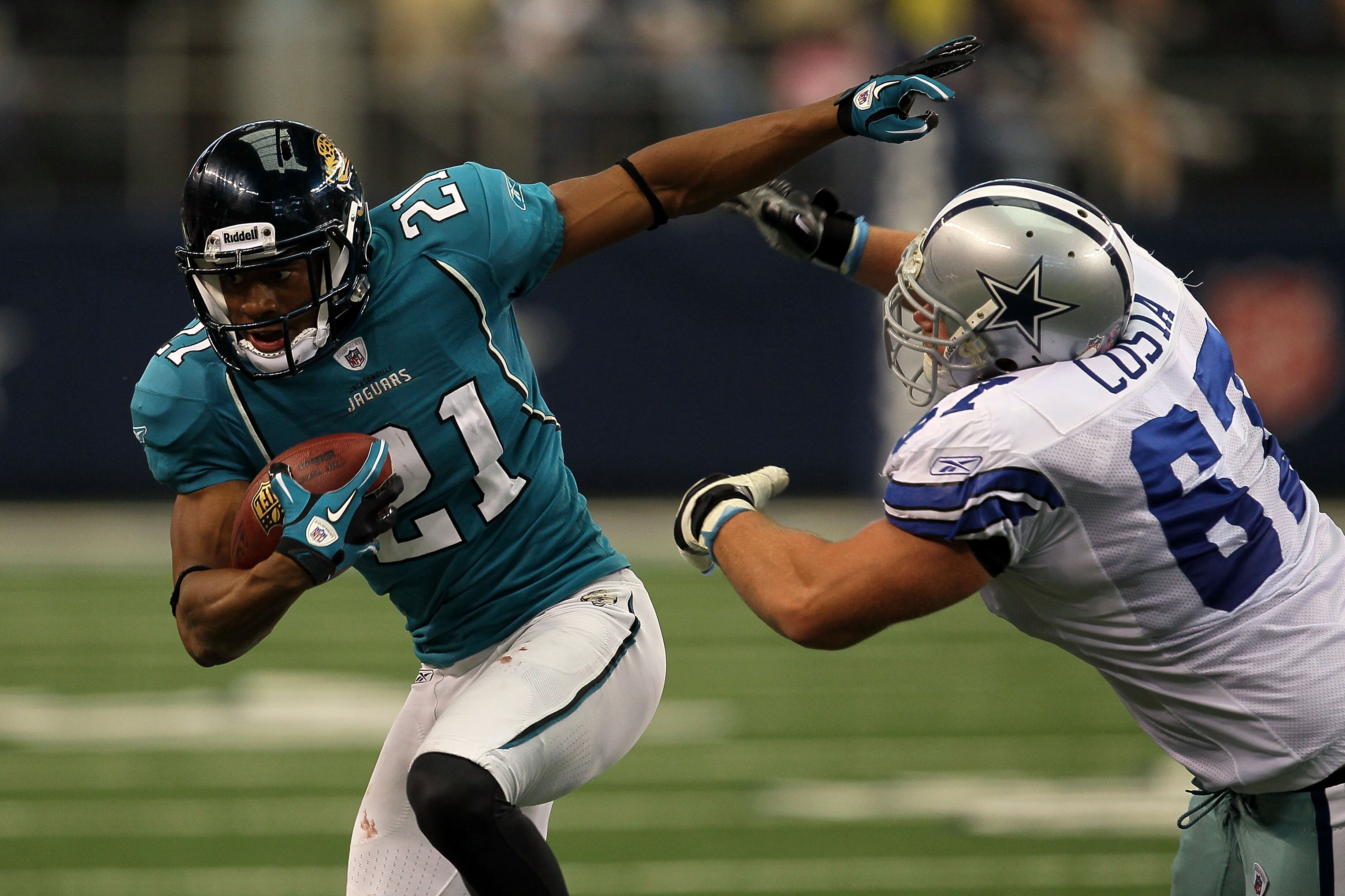 ARLINGTON, TX - OCTOBER 31:  Derek Cox #21 of the Dallas Cowboys returns an interception for positive yards in the third quarter against the Jacksonville Jaguars at Cowboys Stadium on October 31, 2010 in Arlington, Texas.  (Photo by Stephen Dunn/Getty Ima